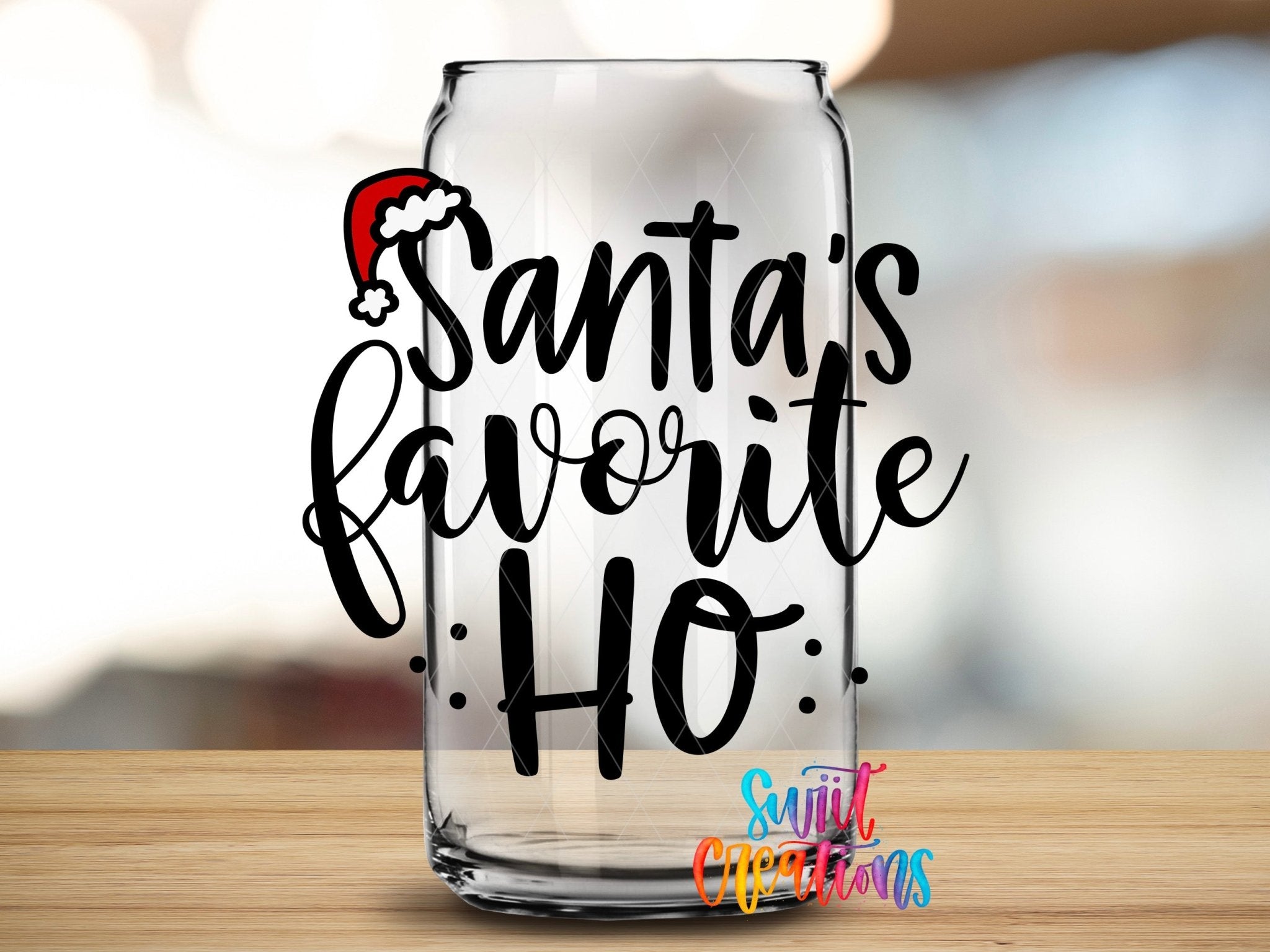 Swiit Creations UV DTF Santa’s Favorite Ho Christmas transfer applied to a clear glass can