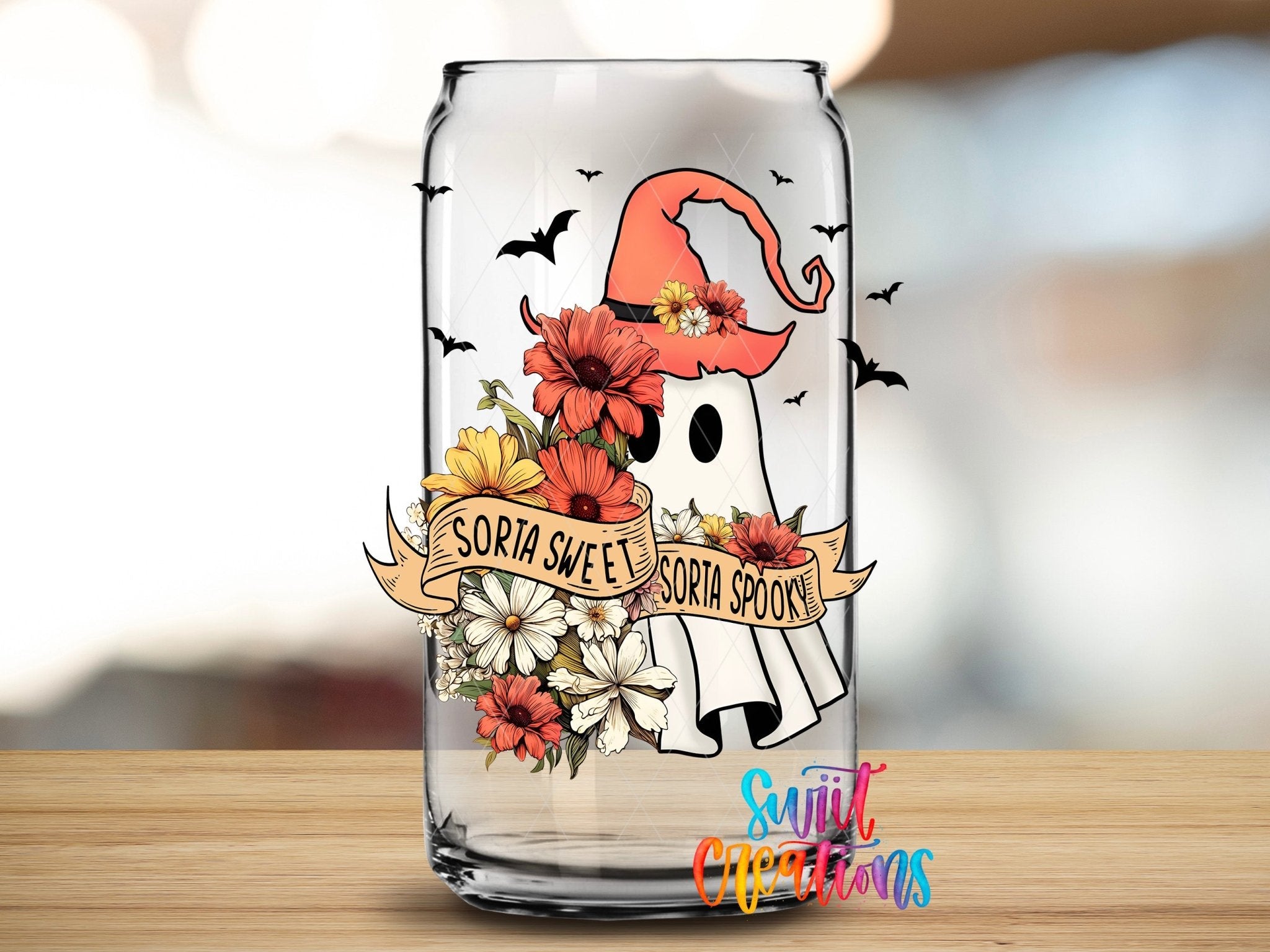 Swiit Creations UV DTF Sorta Sweet Spooky Ghost Floral Halloween transfer applied to a clear glass can