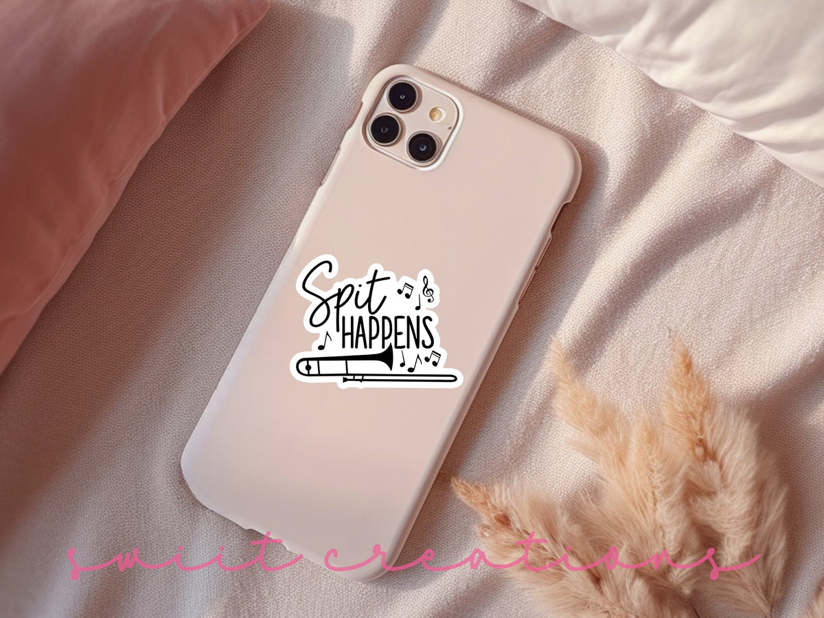 Spit Happens sticker on a pink phone case