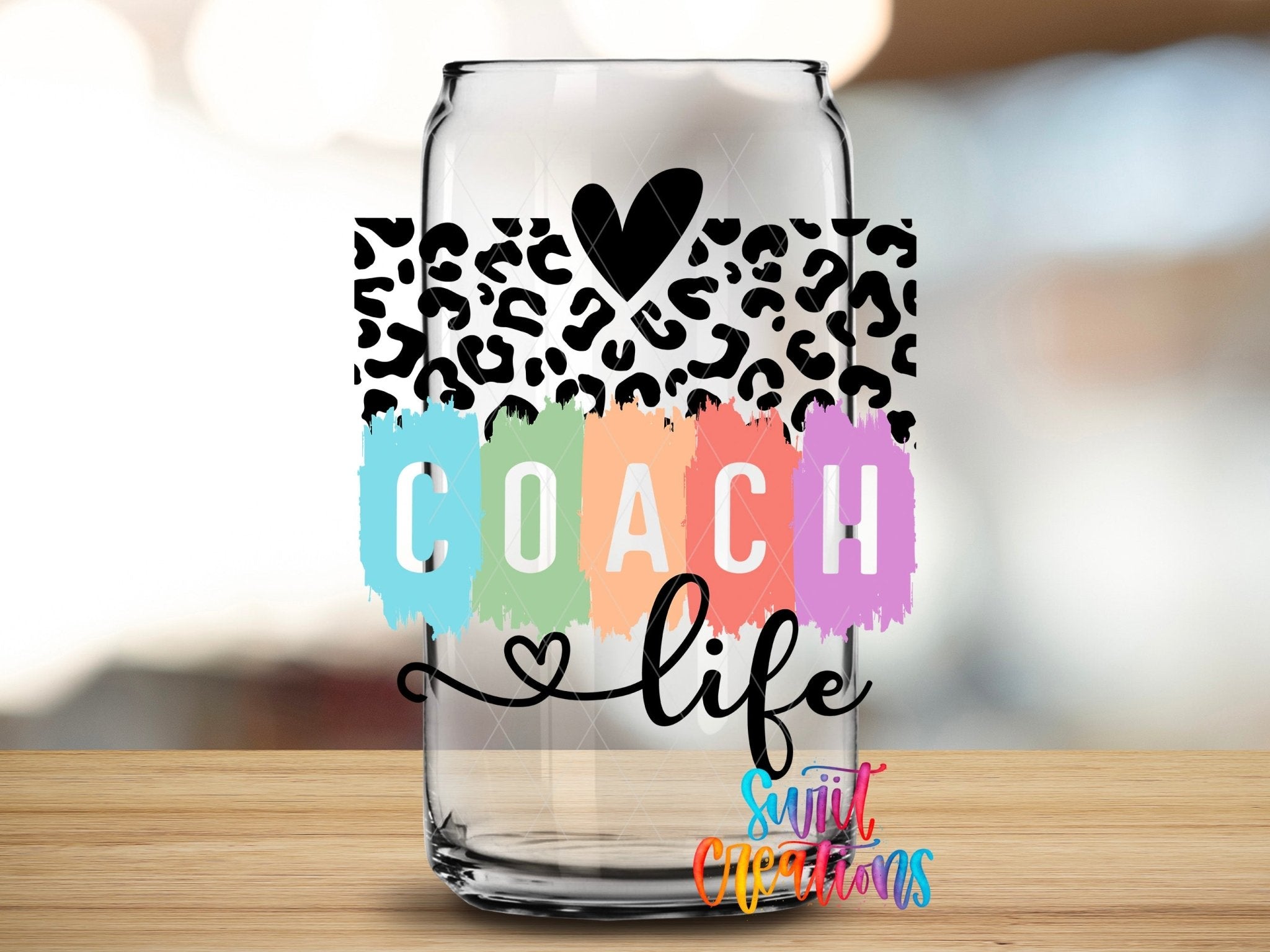 Sport Coach Life Leopard UV DTF transfer applied to a clear glass can from Swiit Creations