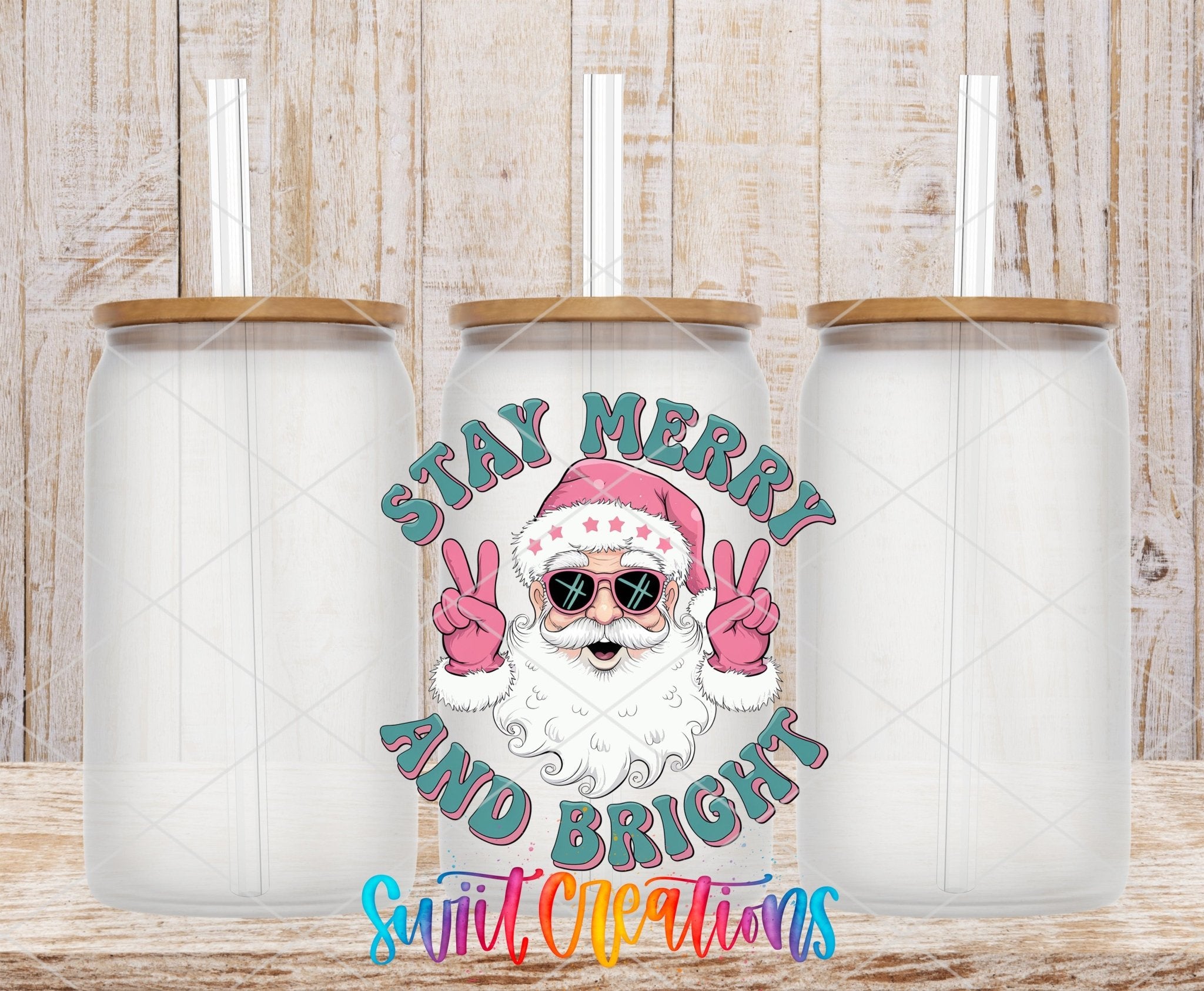 Swiit Creations UV DTF Stay Merry and Bright Santa transfer shown on a clear glass can set