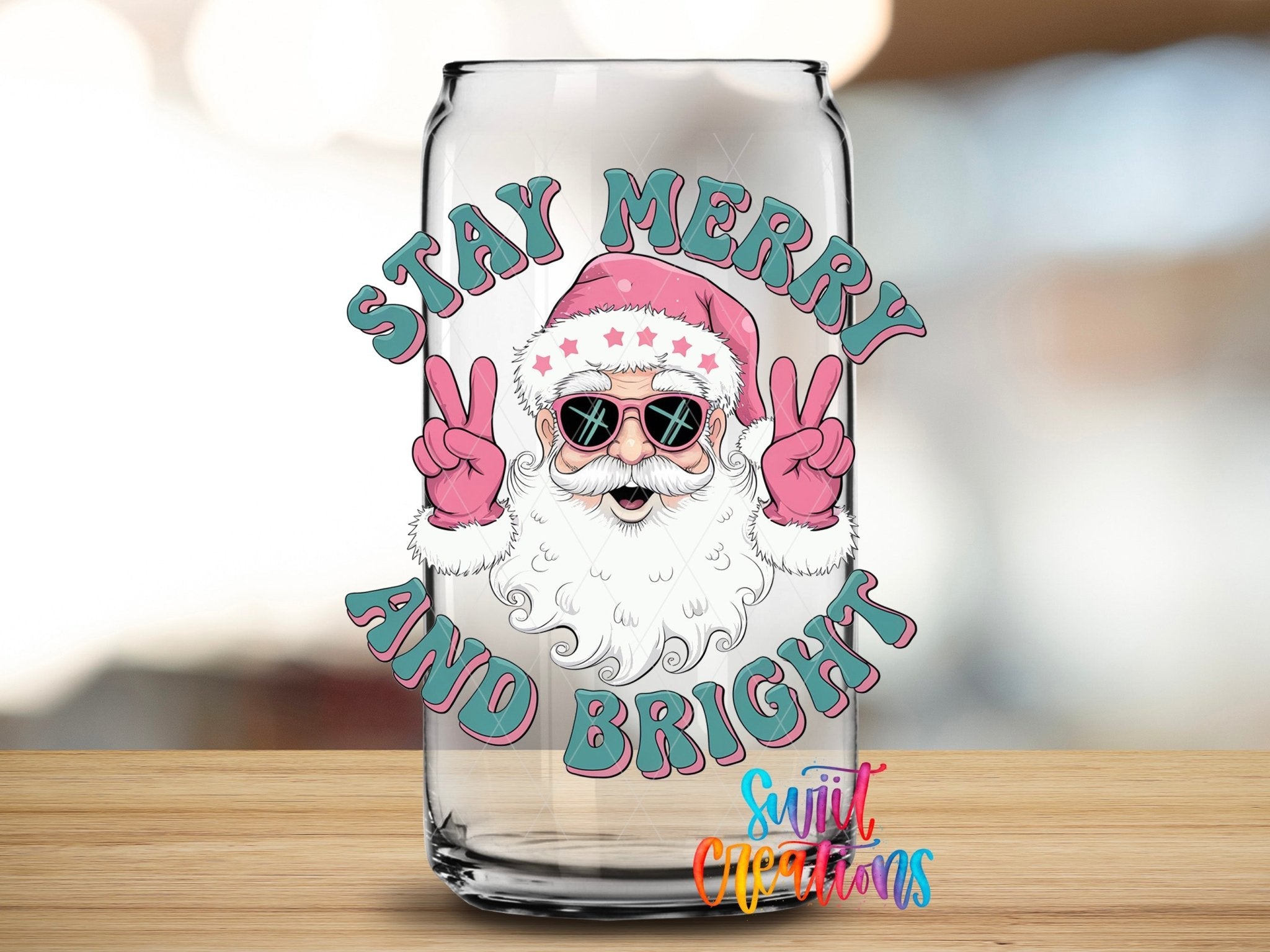 Swiit Creations UV DTF Stay Merry and Bright Santa transfer applied to a clear glass can