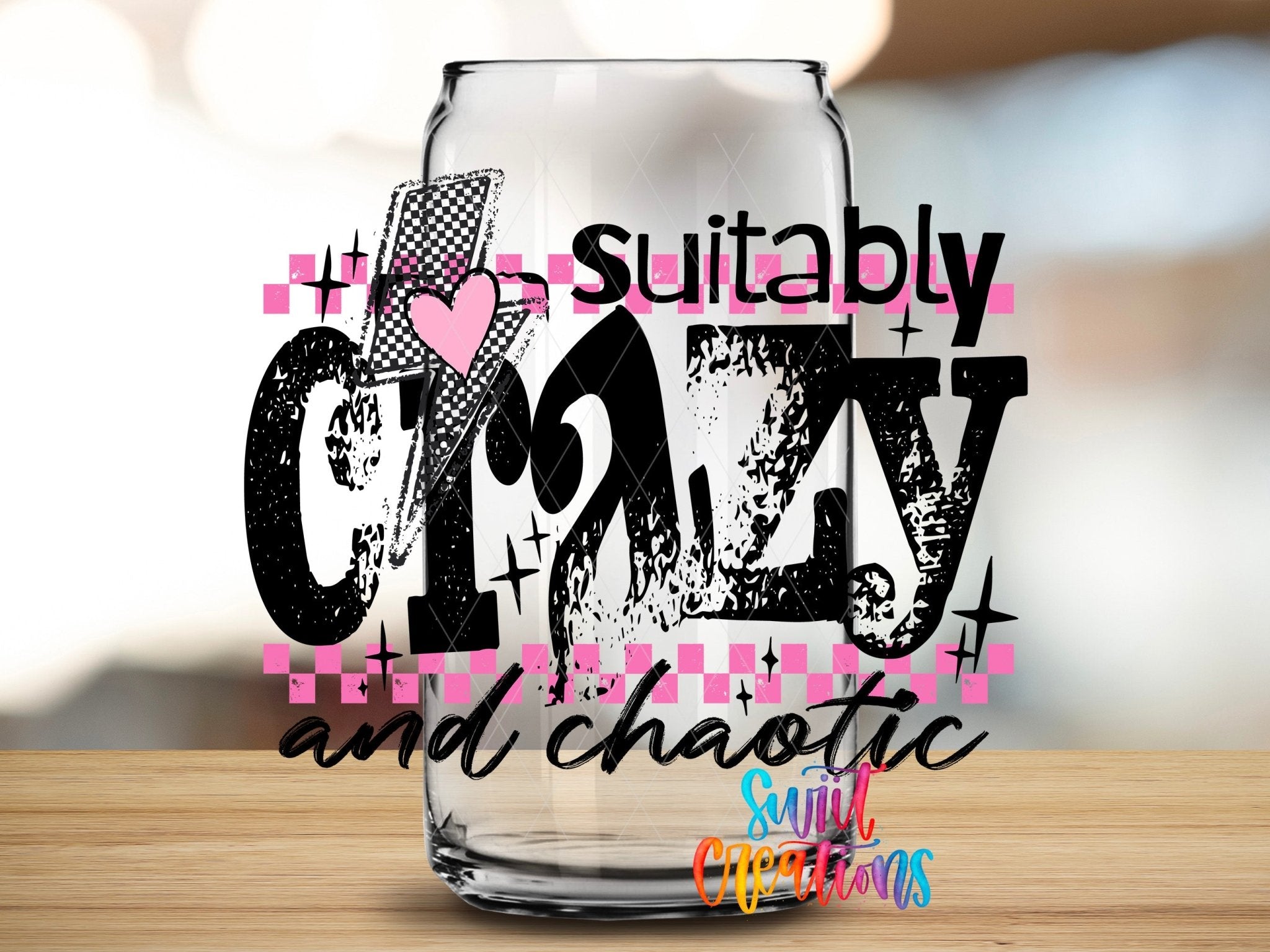 Suitably Crazy And Chaotic UV DTF transfer applied to a clear glass can from Swiit Creations