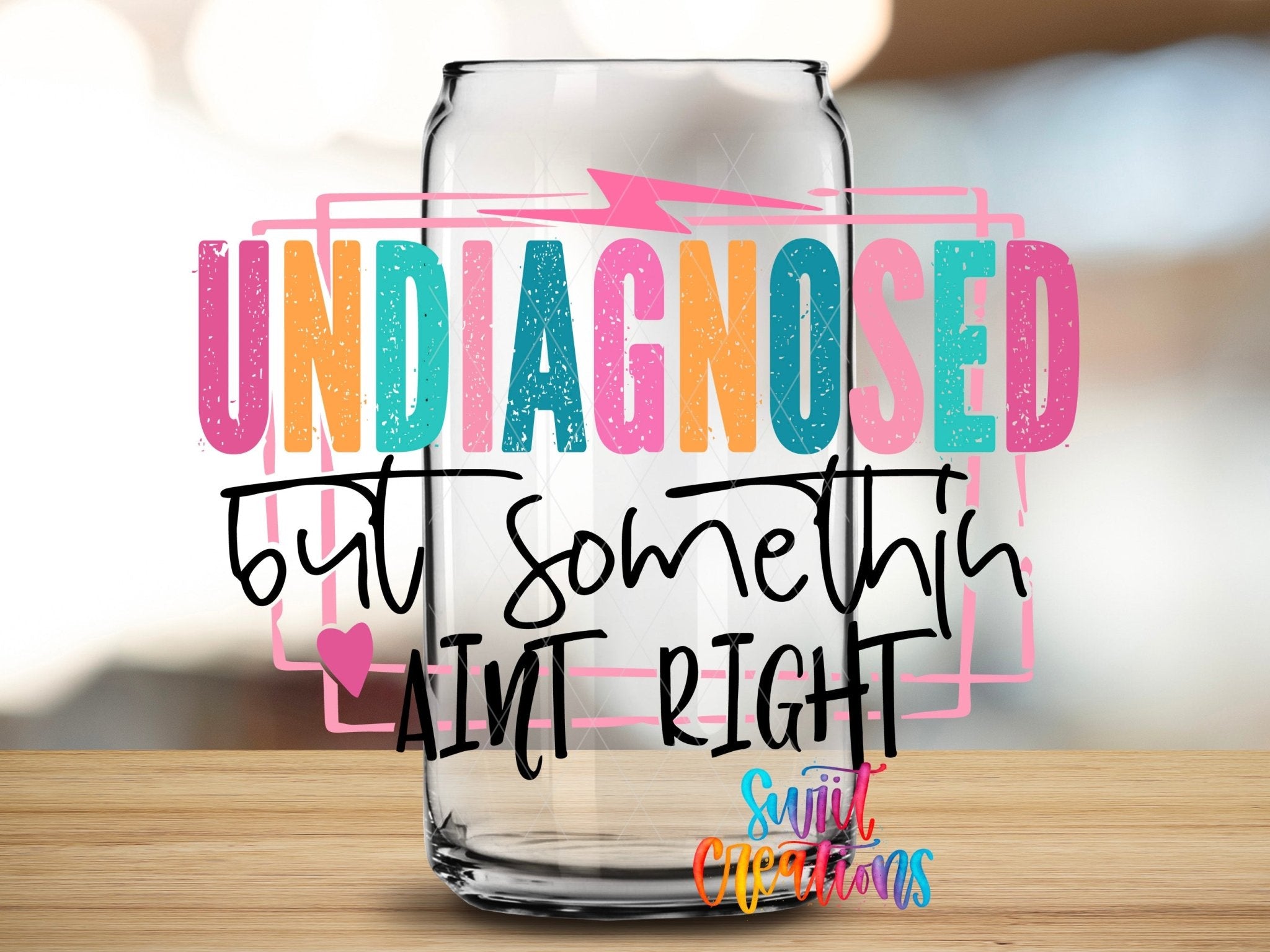 Undiagnosed But Somethin' Ain't Right UV DTF transfer applied to a clear glass can from Swiit Creations