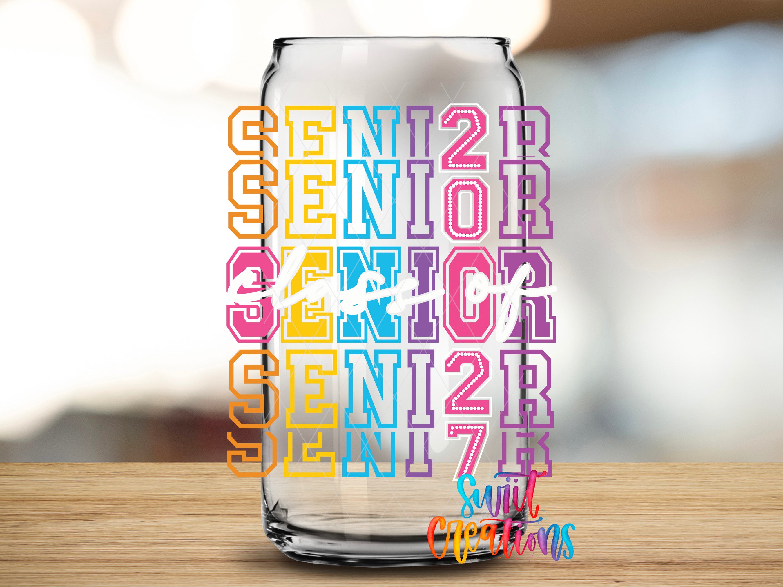 Colorful Senior Class of 2027 UV DTF transfer mockup on a clear glass cup by Swiit Creations.