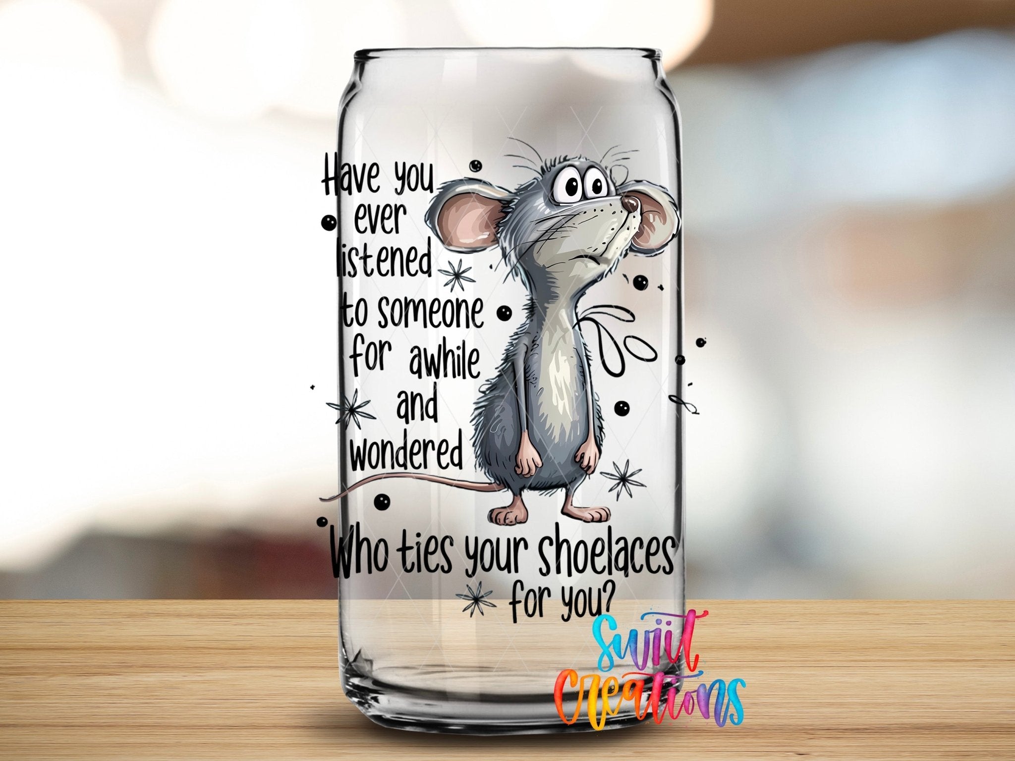 Who Ties Your Shoelaces UV DTF transfer applied to a clear glass can from Swiit Creations