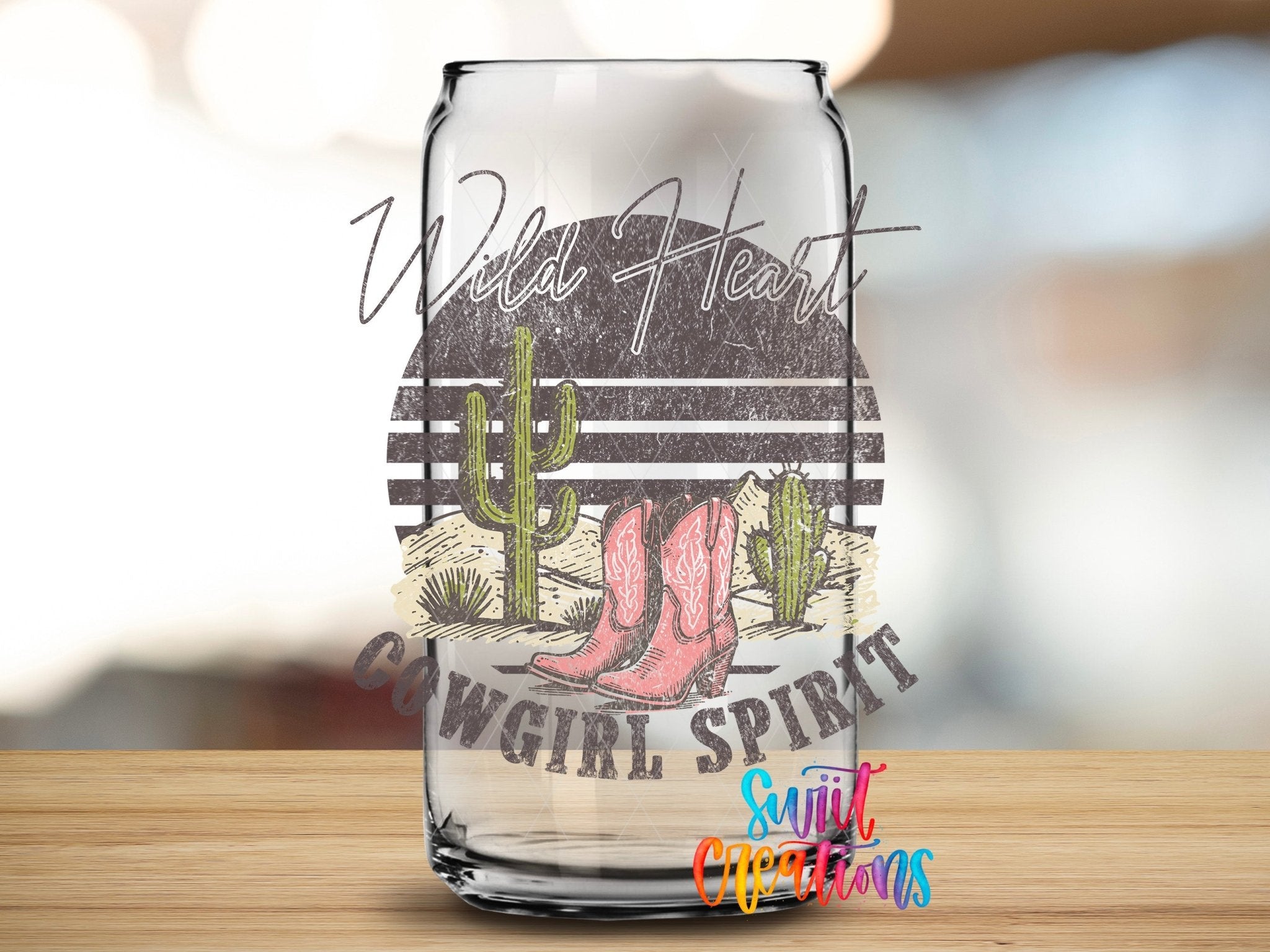 Wild Heart Cowgirl Spirit UV DTF transfer applied to a clear glass can from Swiit Creations