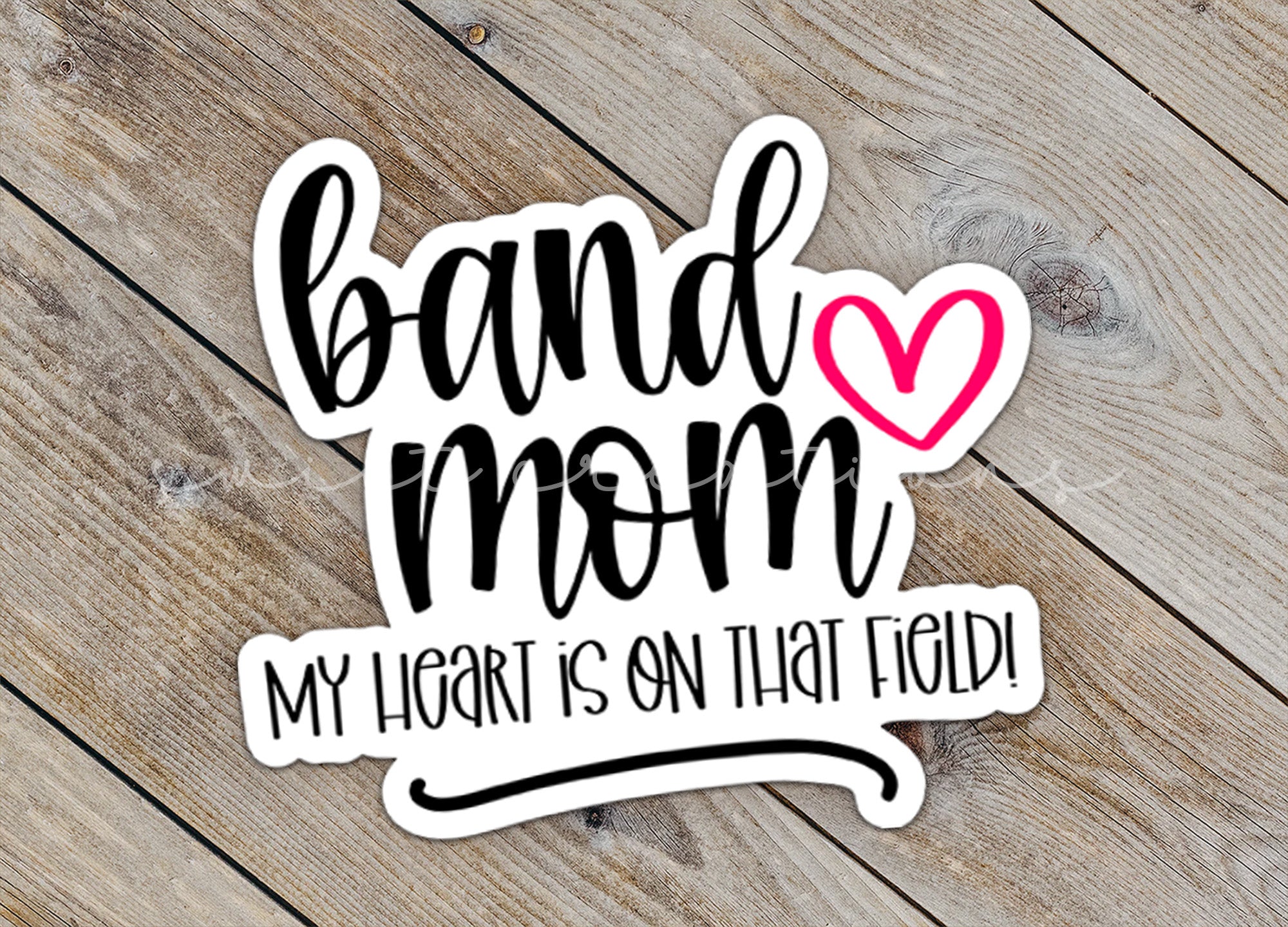 a sticker that says band mom my heart is on that field