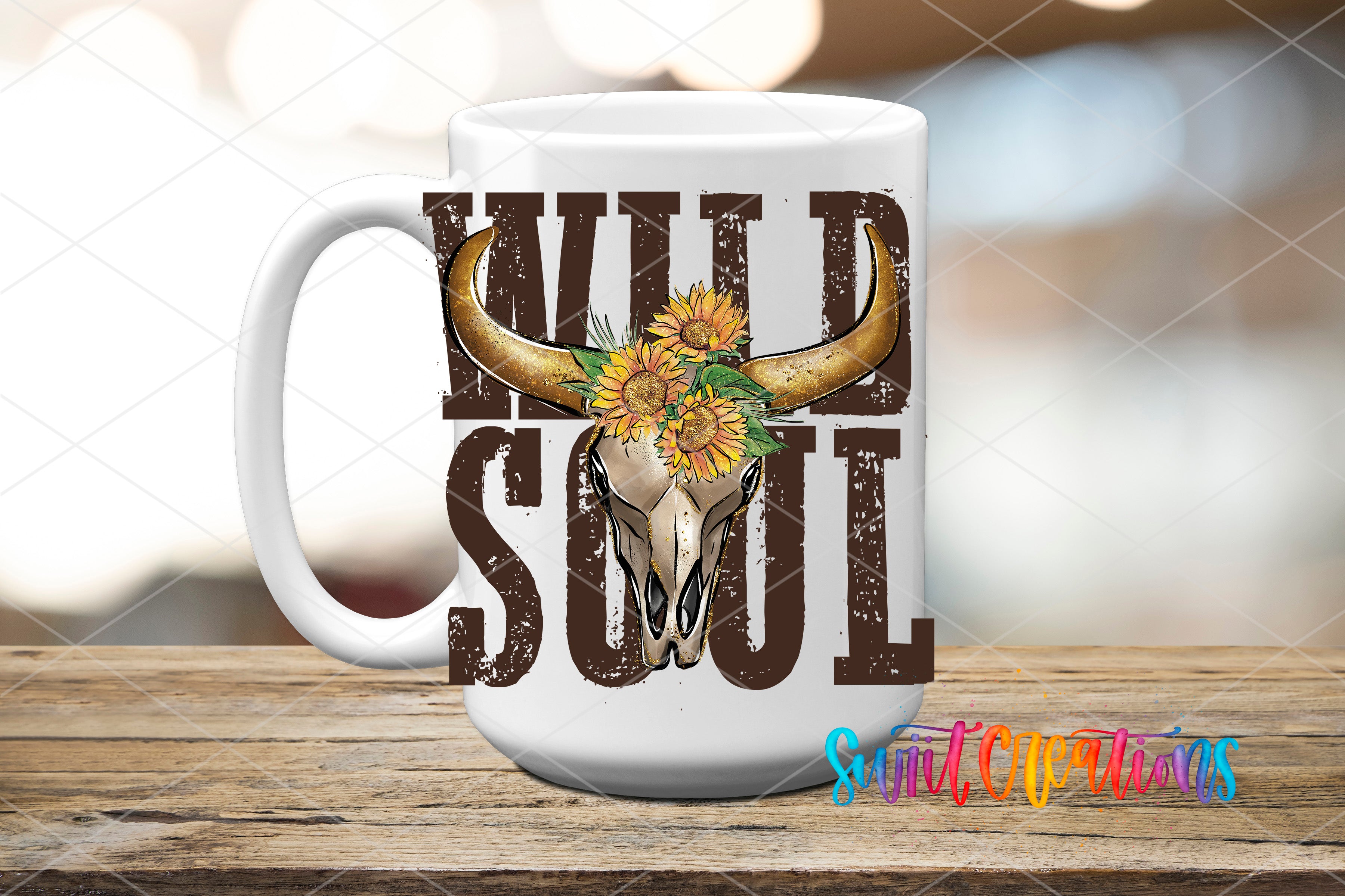 A white mug with a graphic design featuring a bull skull and sunflowers, along with the text "WILD SOUL" printed on it.