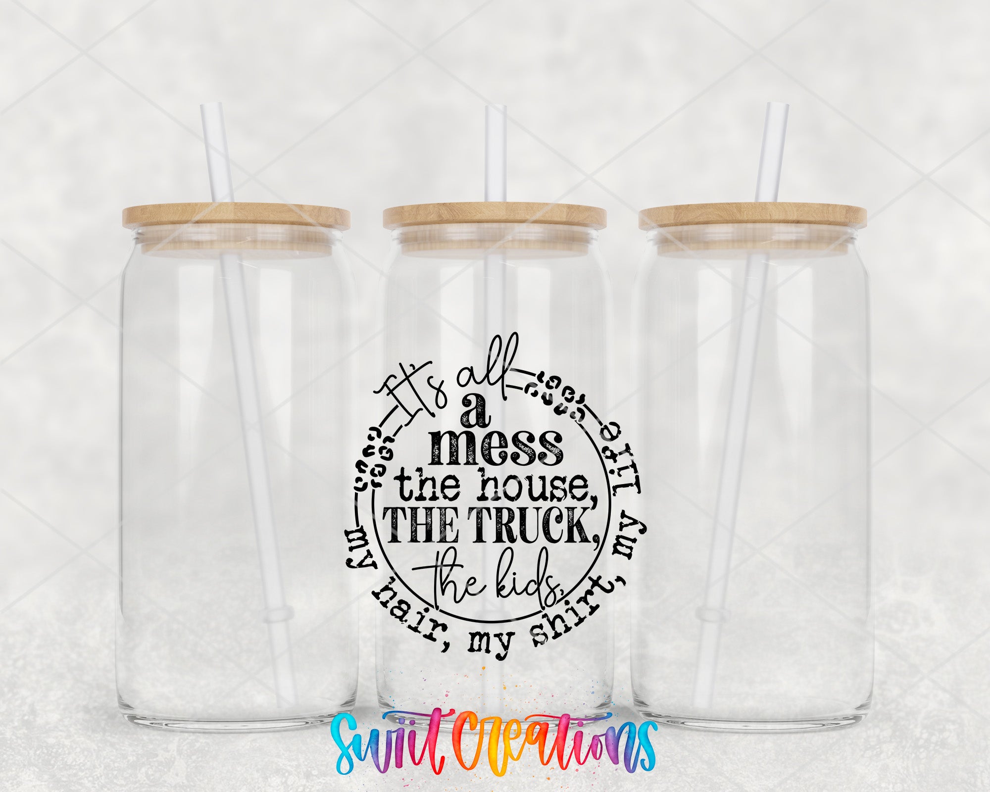 a couple of glass cups with straws in them