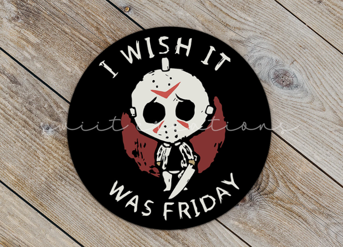 Close-up of the I Wish It Was Friday sticker on rustic wood