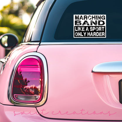 a pink car that has a sticker on it
