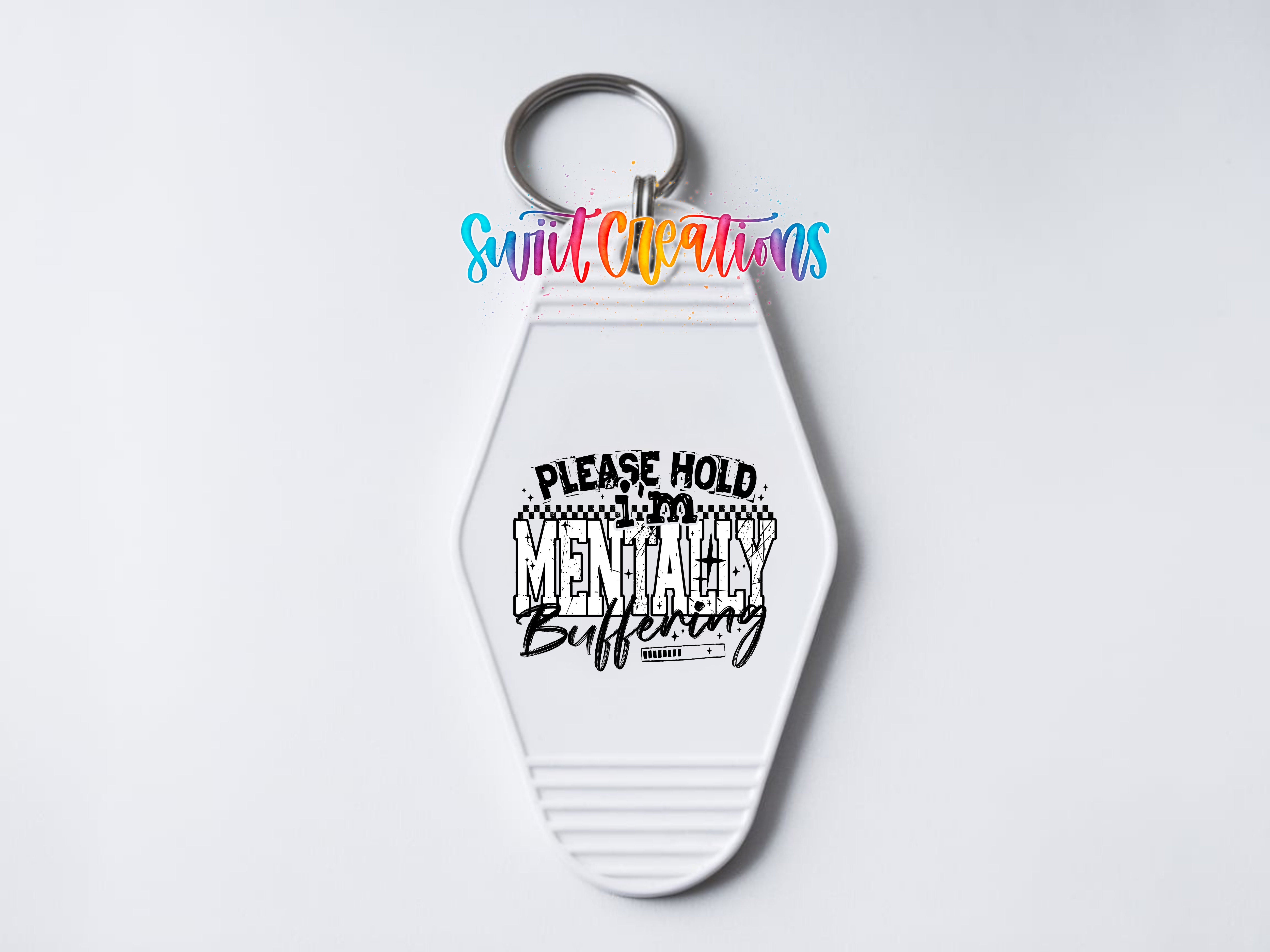 A white keychain with a keyring and a colorful text logo above it.