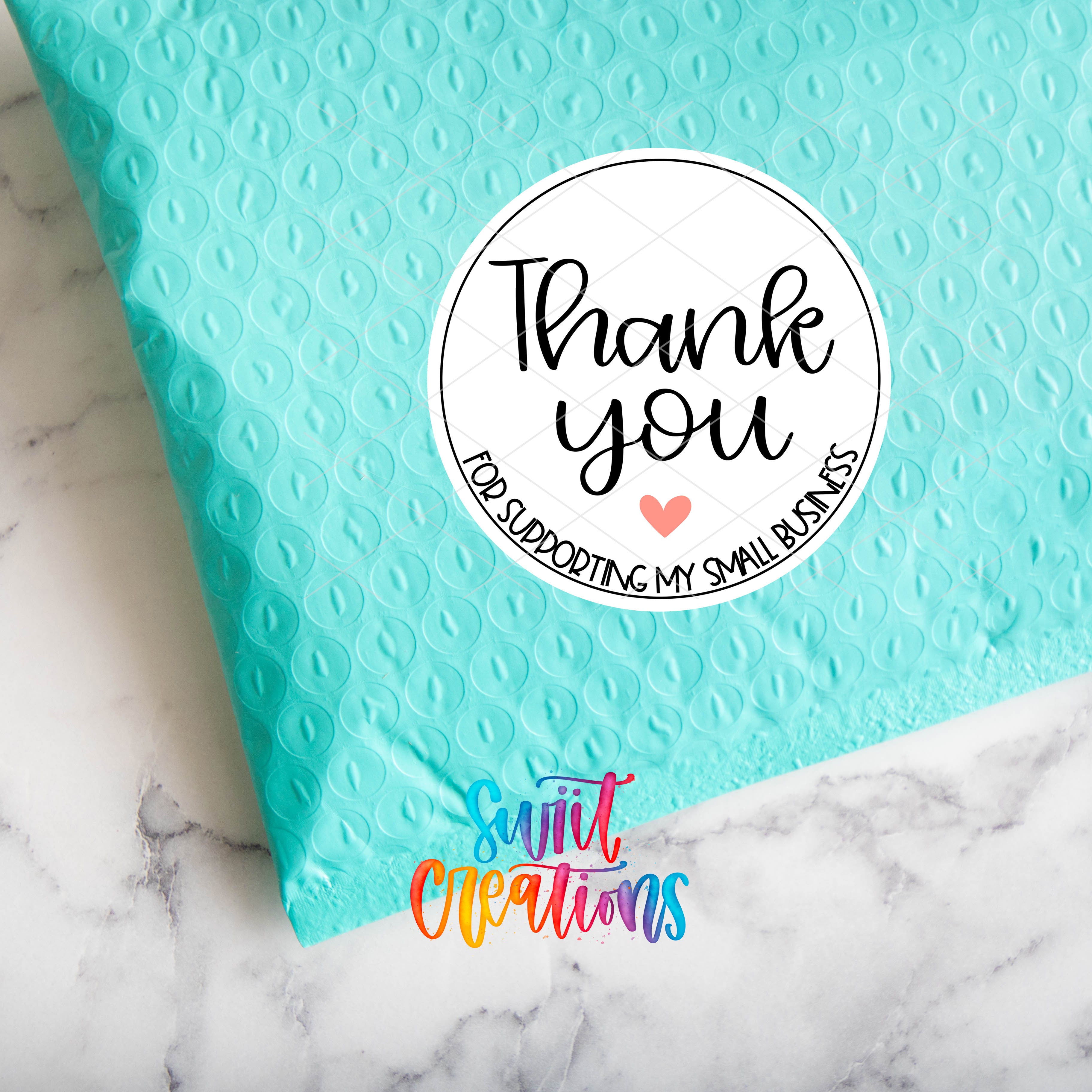 a blue bag with a thank you sticker on it