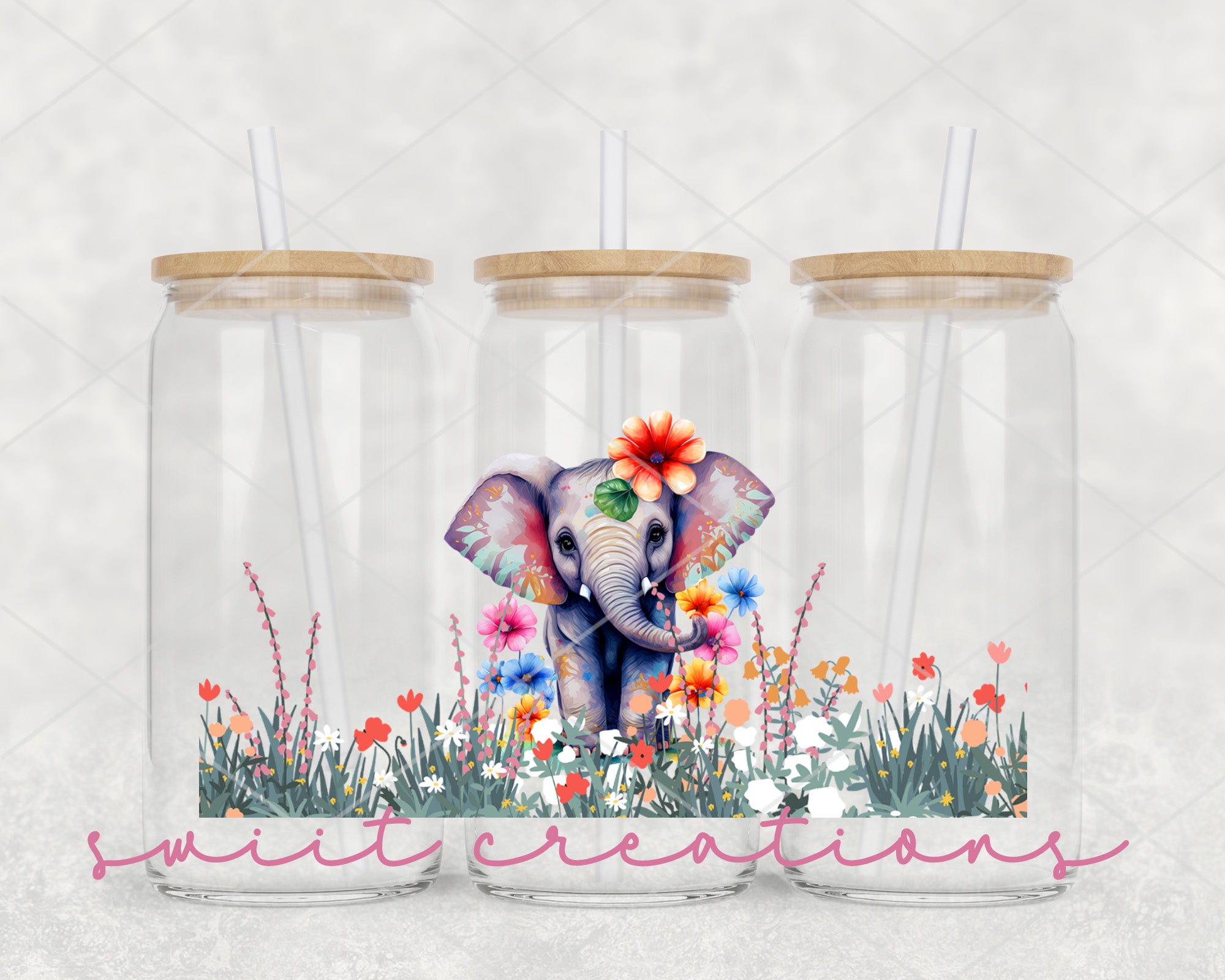 two glass jars with a picture of an elephant and flowers in them
