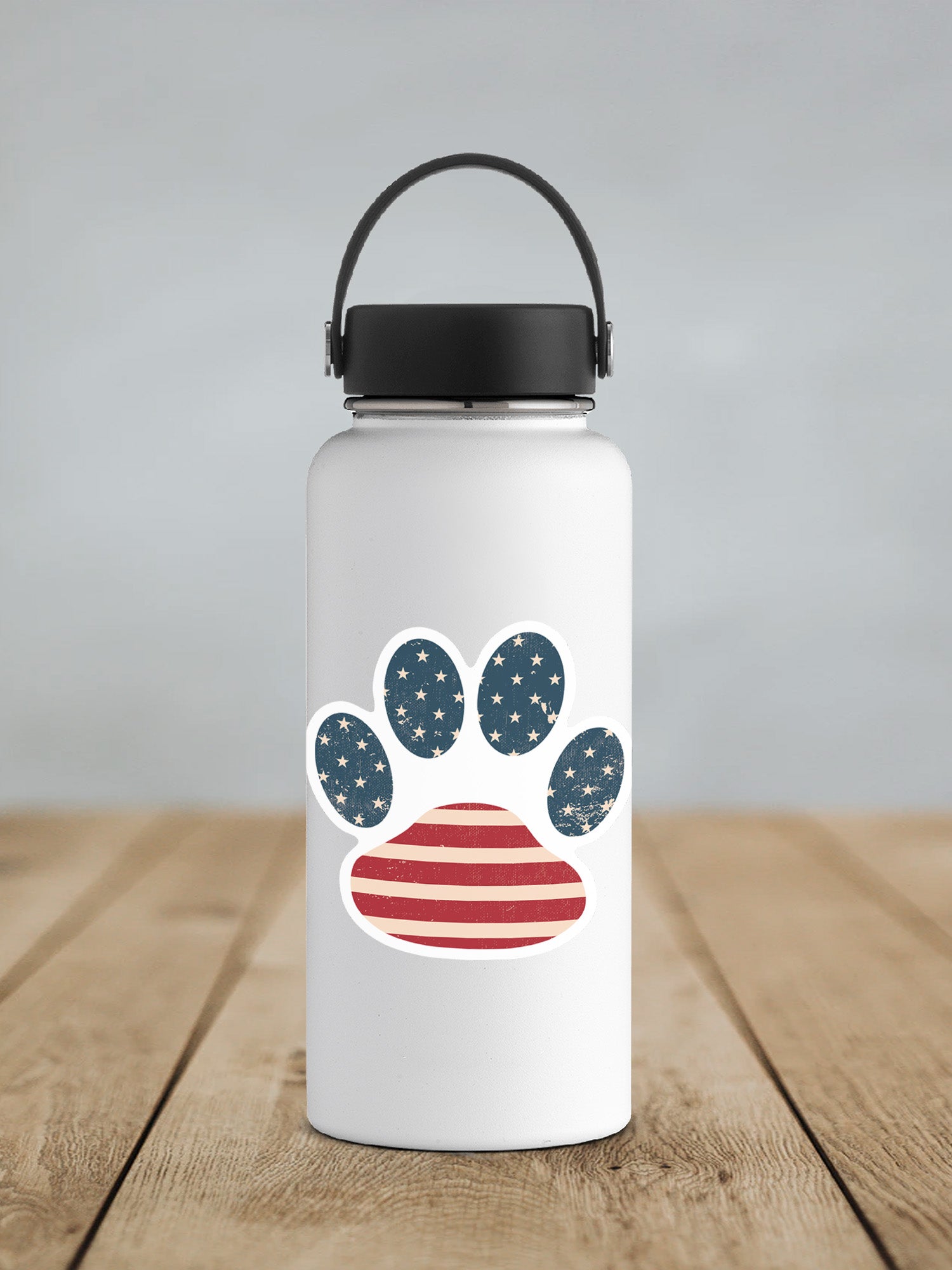 a water bottle with a paw print on it