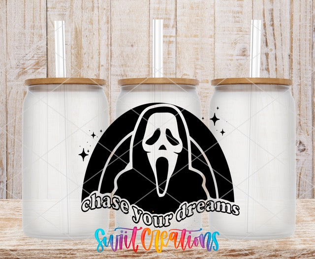 two white coffee mugs with a black and white image of a ghost