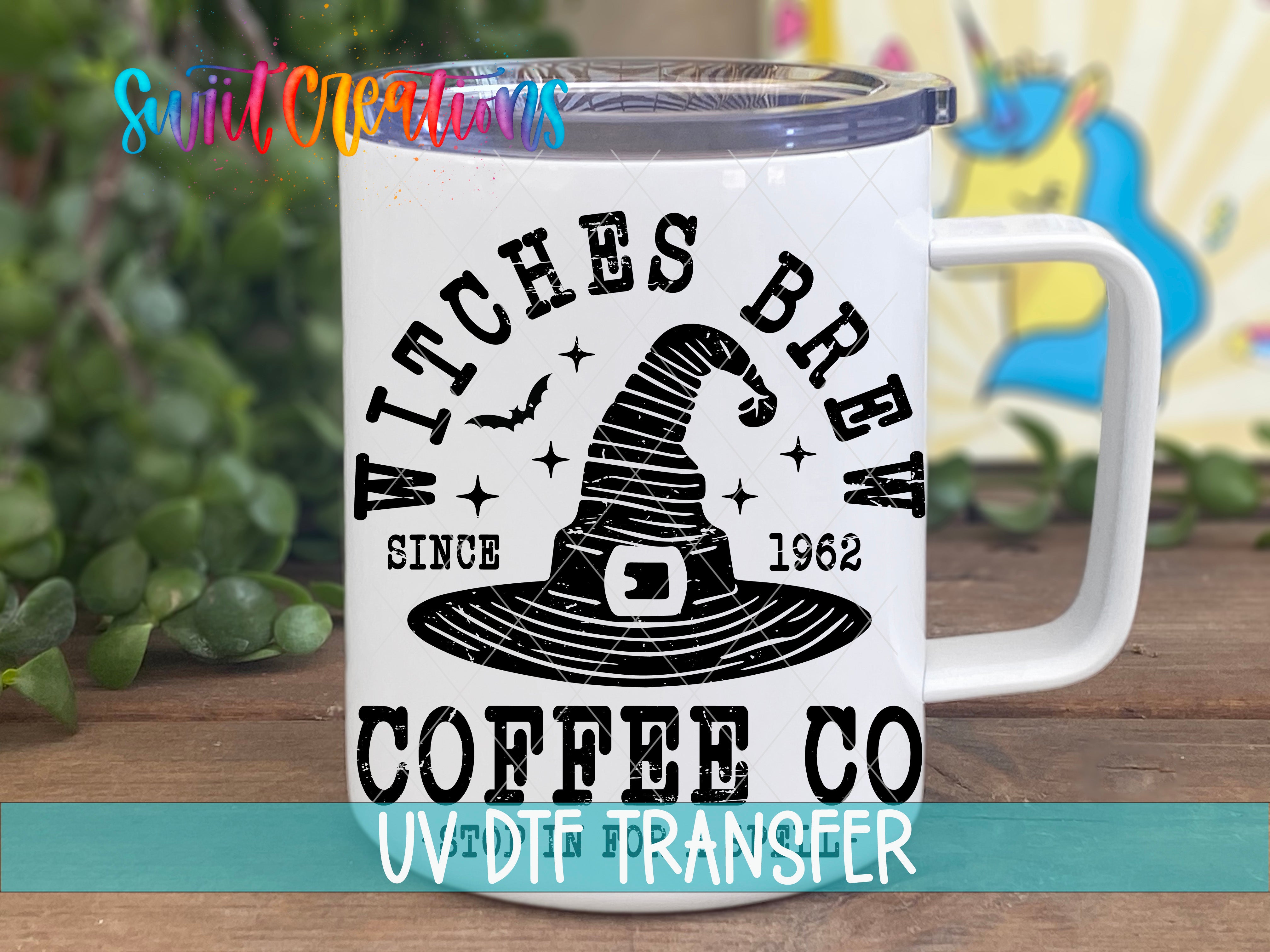 A white coffee mug with a black and white graphic design featuring a witch's hat and the text "WITCHES BREW" and "COFFEE CO" printed on it.