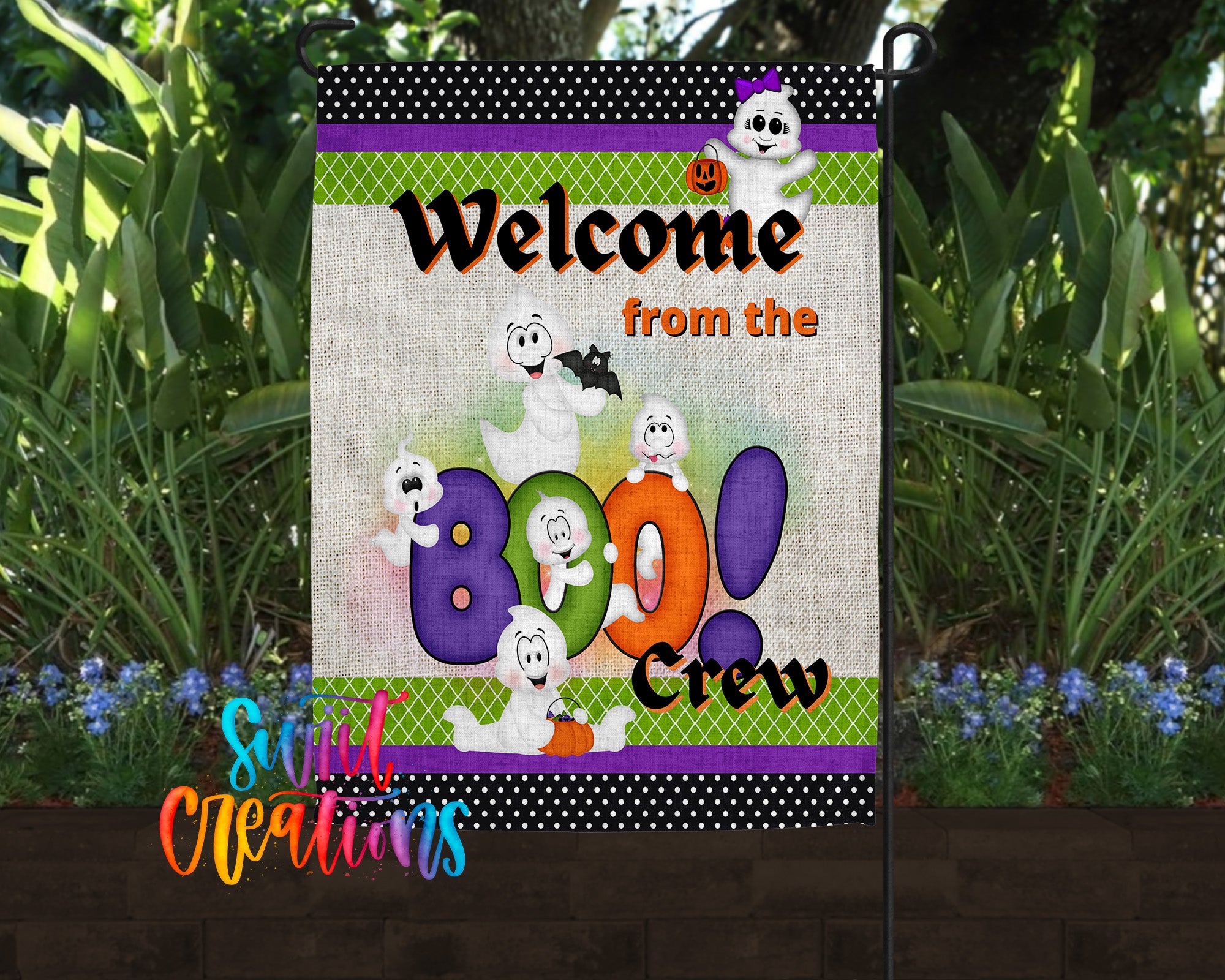 A colorful garden sign featuring cartoon characters and text welcoming visitors to the "Boo Crew".