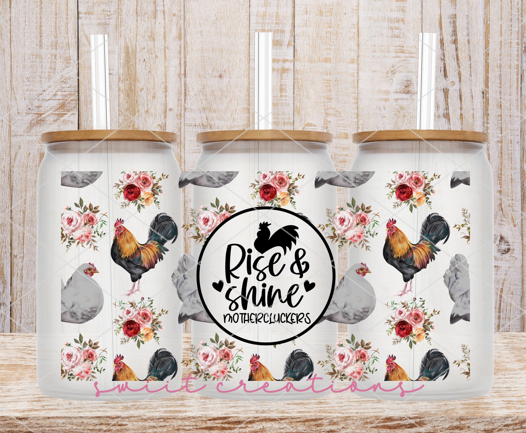 two glass jars with roosters and roses on them