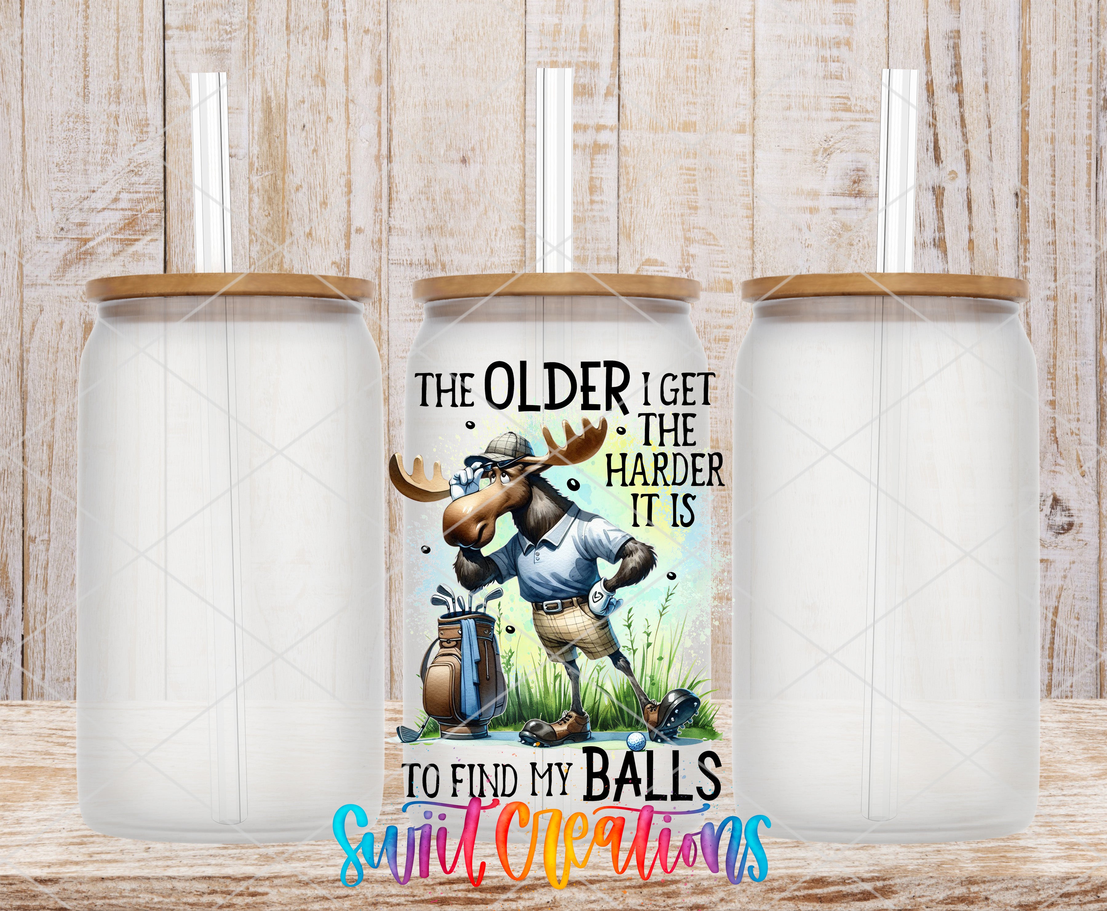 a humorous mug with a cartoon moose holding a golf club and the text "The older I get, the harder it is to find my balls, suit!"