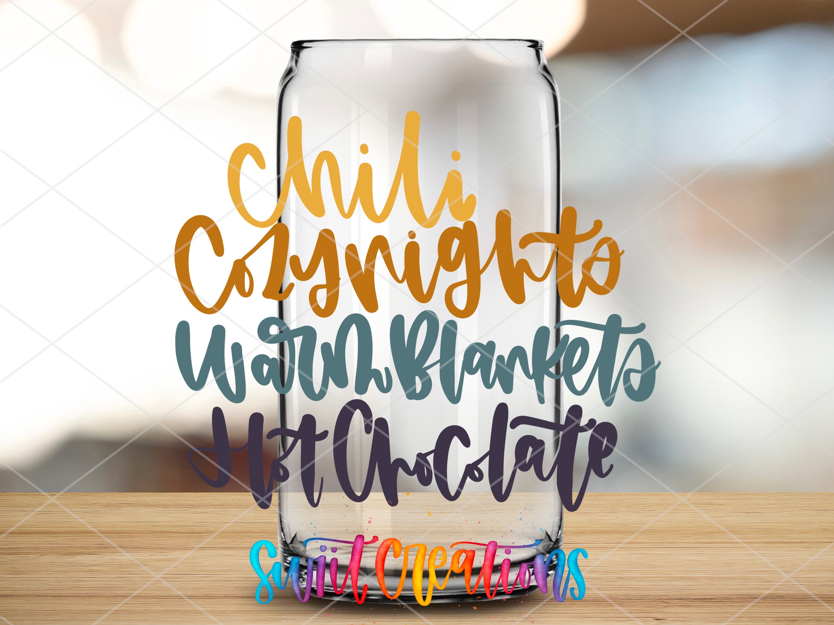 a glass with some writing on it sitting on a table
