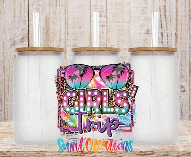 two white coffee mugs with the words girls trip on them