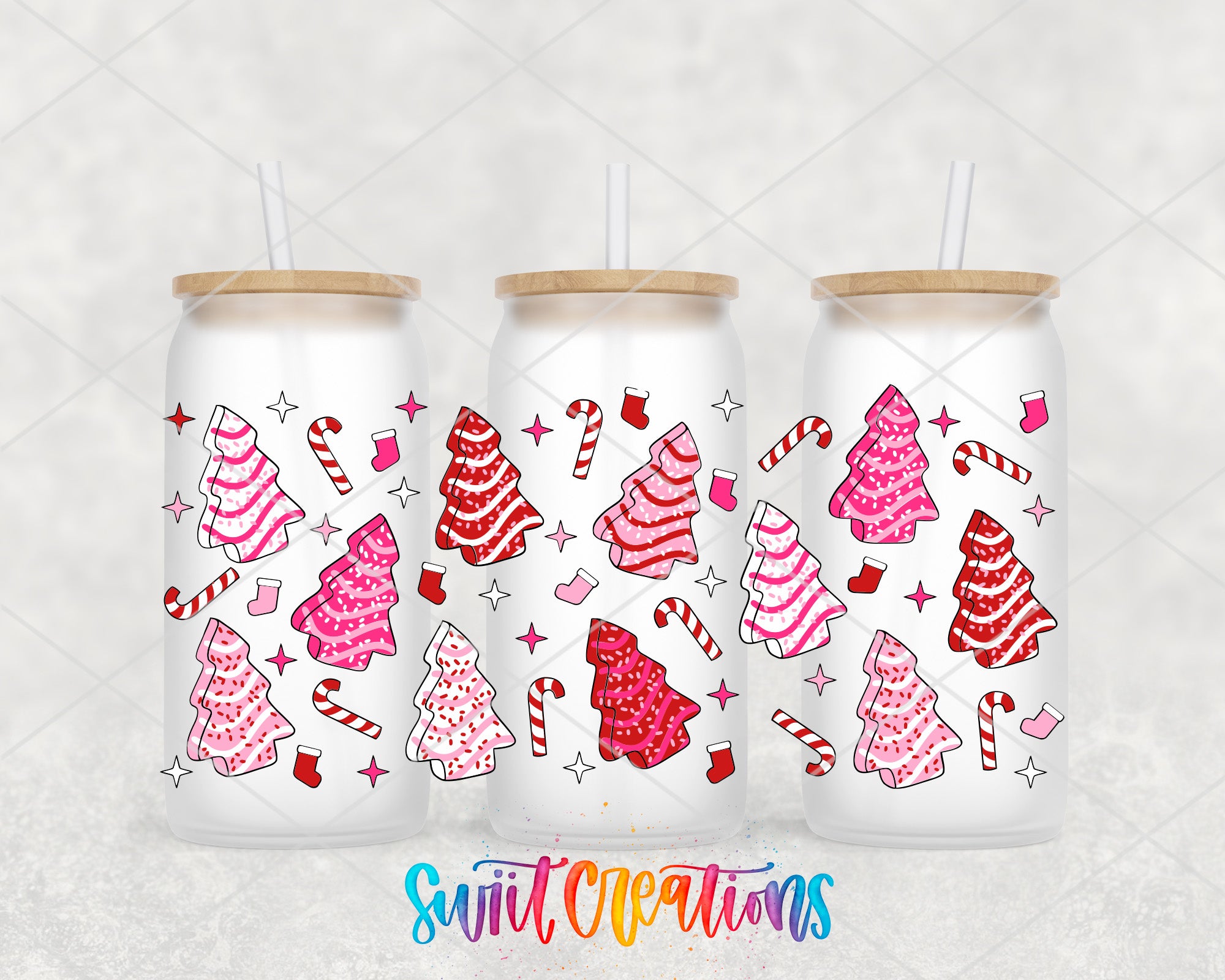 three white tumblers with a festive Christmas tree design and candy canes printed on them.