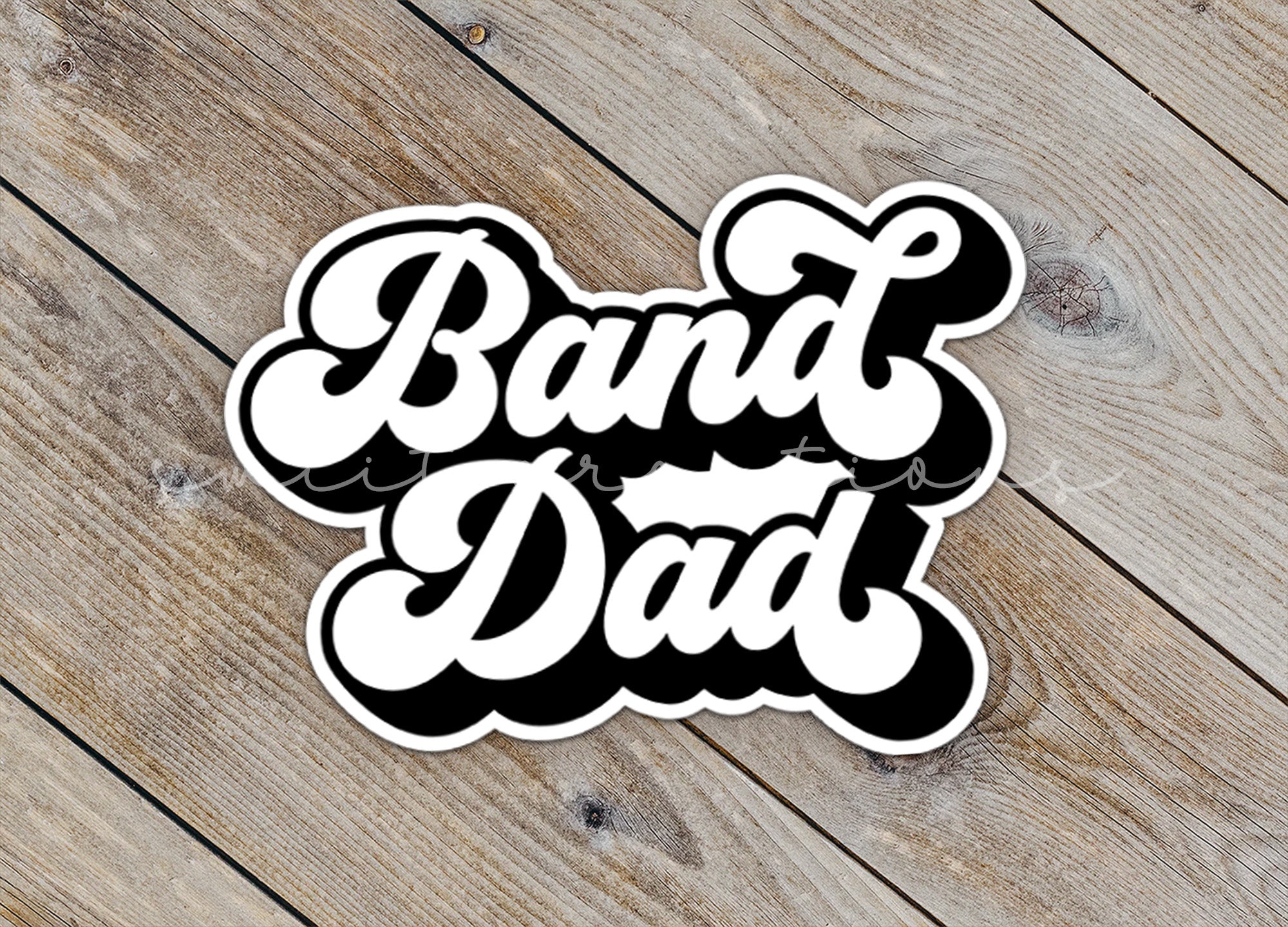 a sticker that says band dad on it