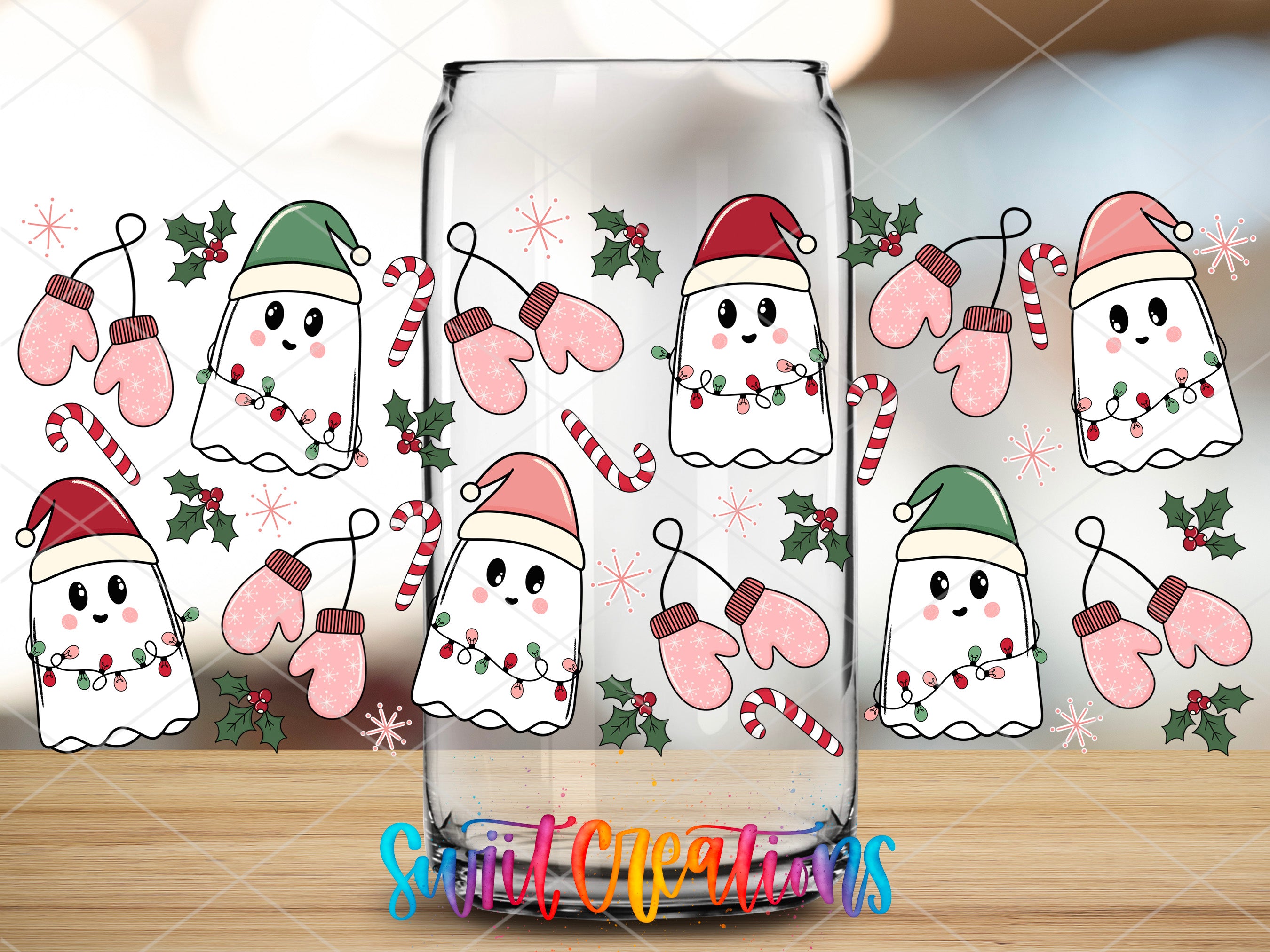 a glass with a picture of a snowman in a santa hat