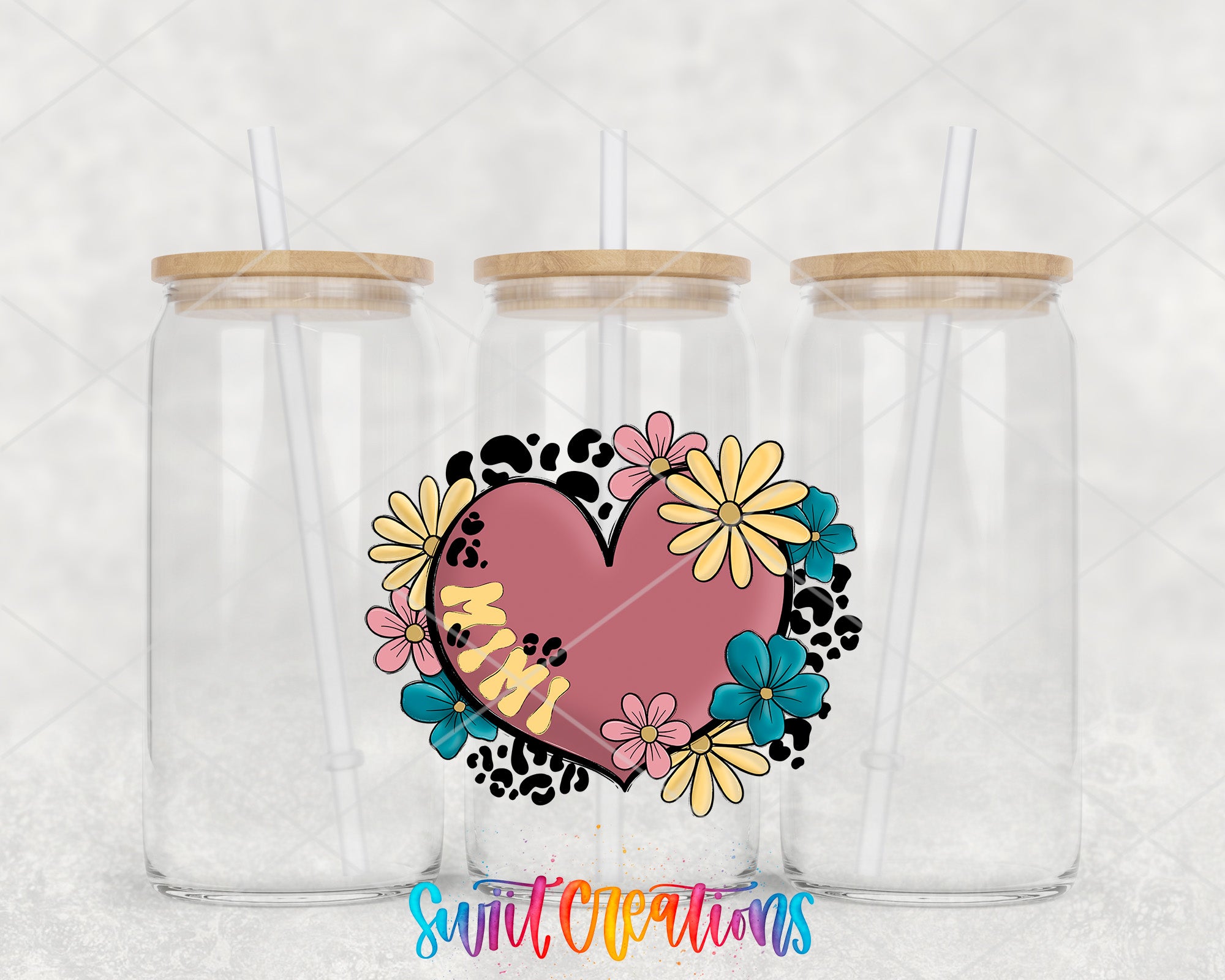 two clear tumblers with a heart and flowers on them