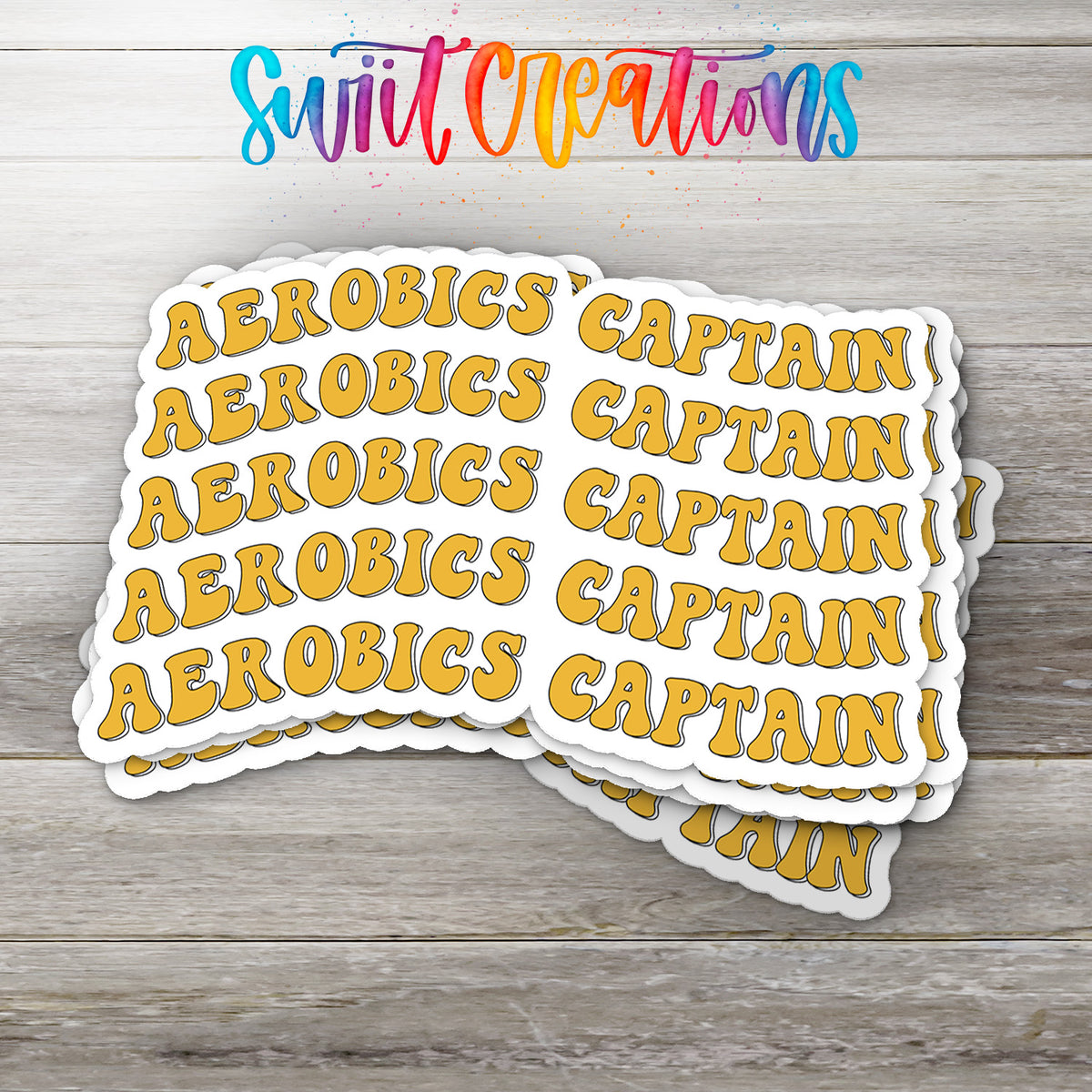 A stack of yellow stickers with the word "CAPTAIN" written on them, placed on a wooden surface.