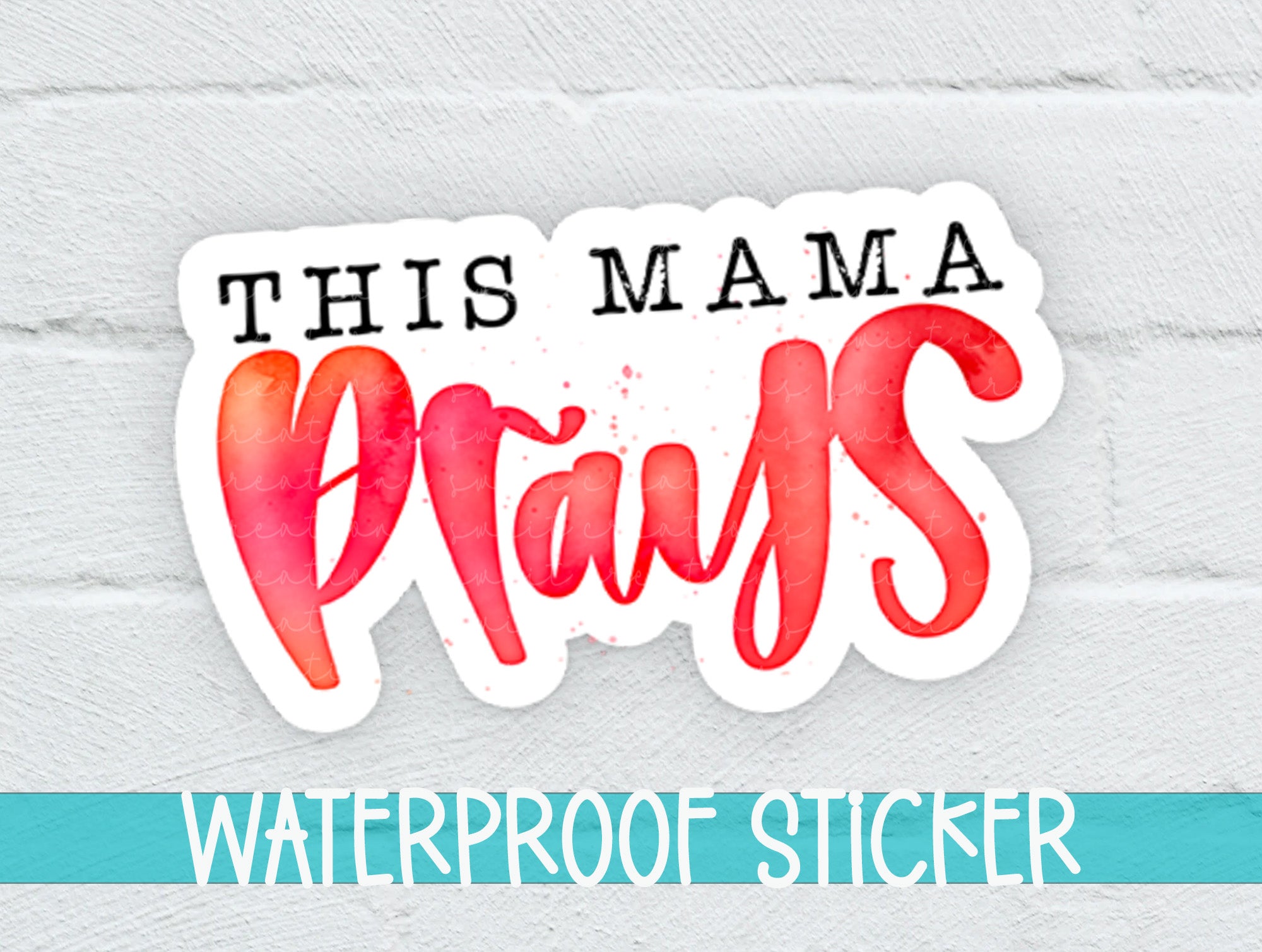 this mama prays watercolor sticker on a white brick wall