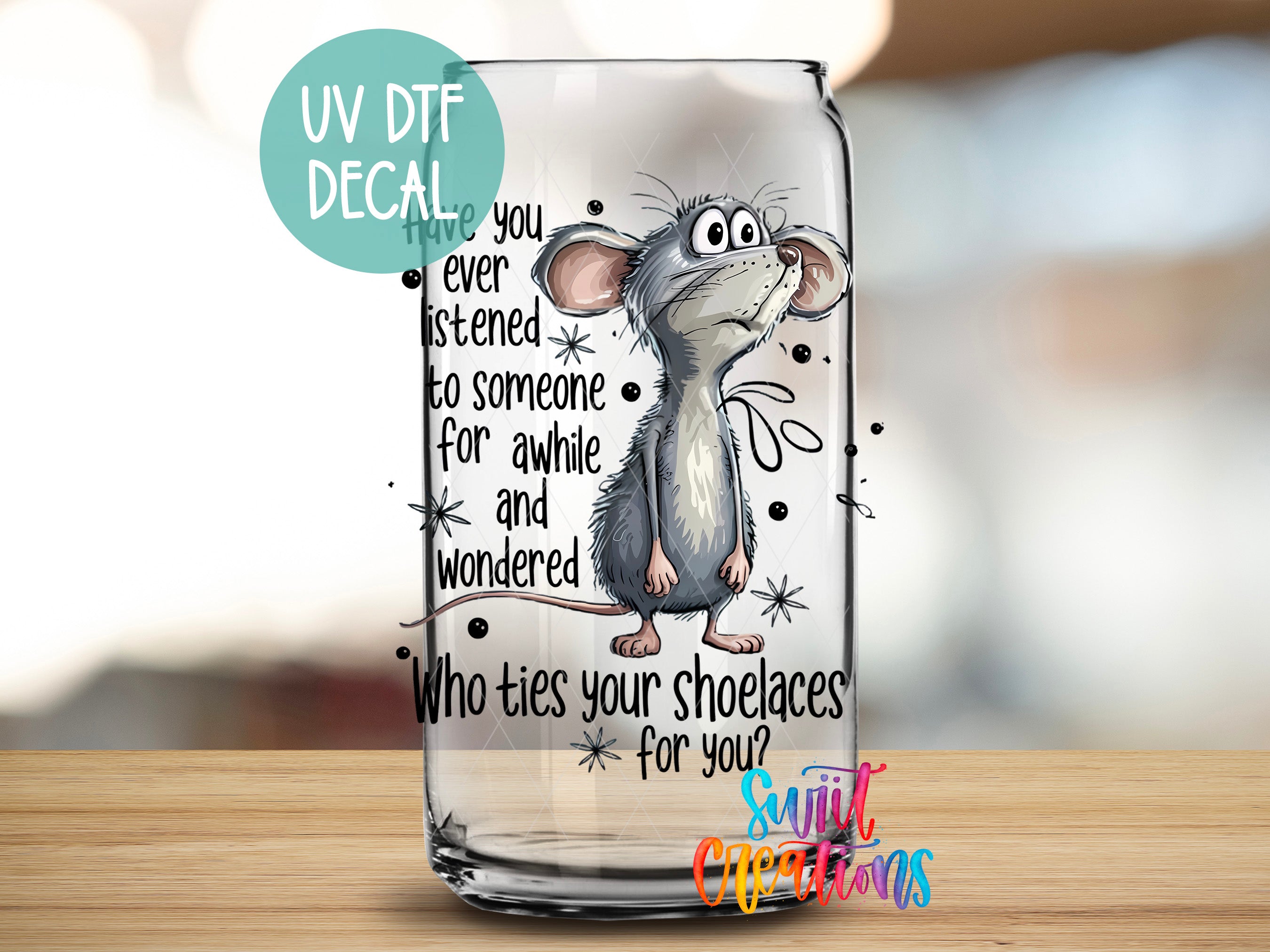 A glass jar with a cartoon mouse and text printed on it.