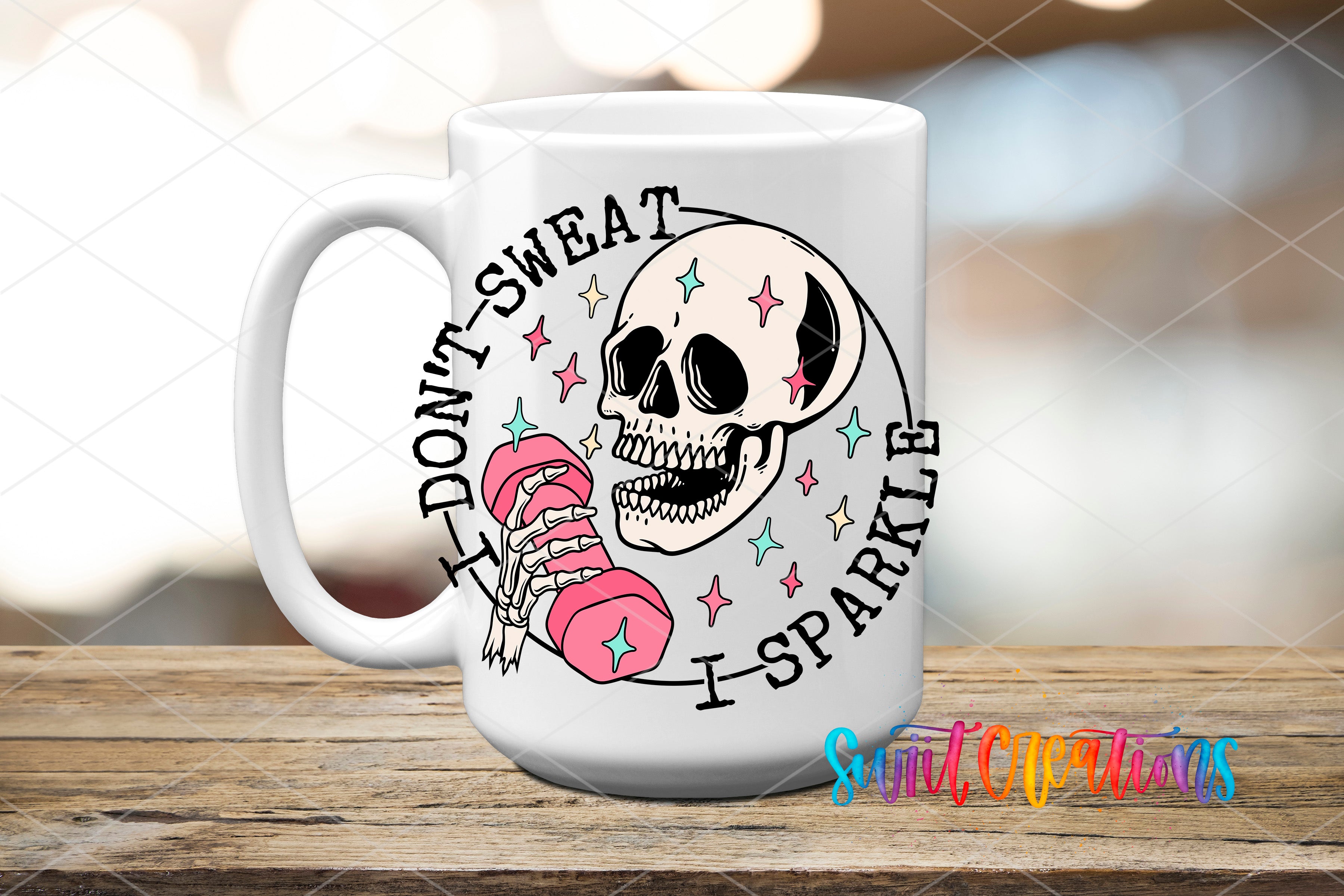 A white ceramic mug with a graphic design featuring a skull and a pink dumbbell, along with the text "I DON'T SWEAT I SPARKLE" and a colorful watermark.