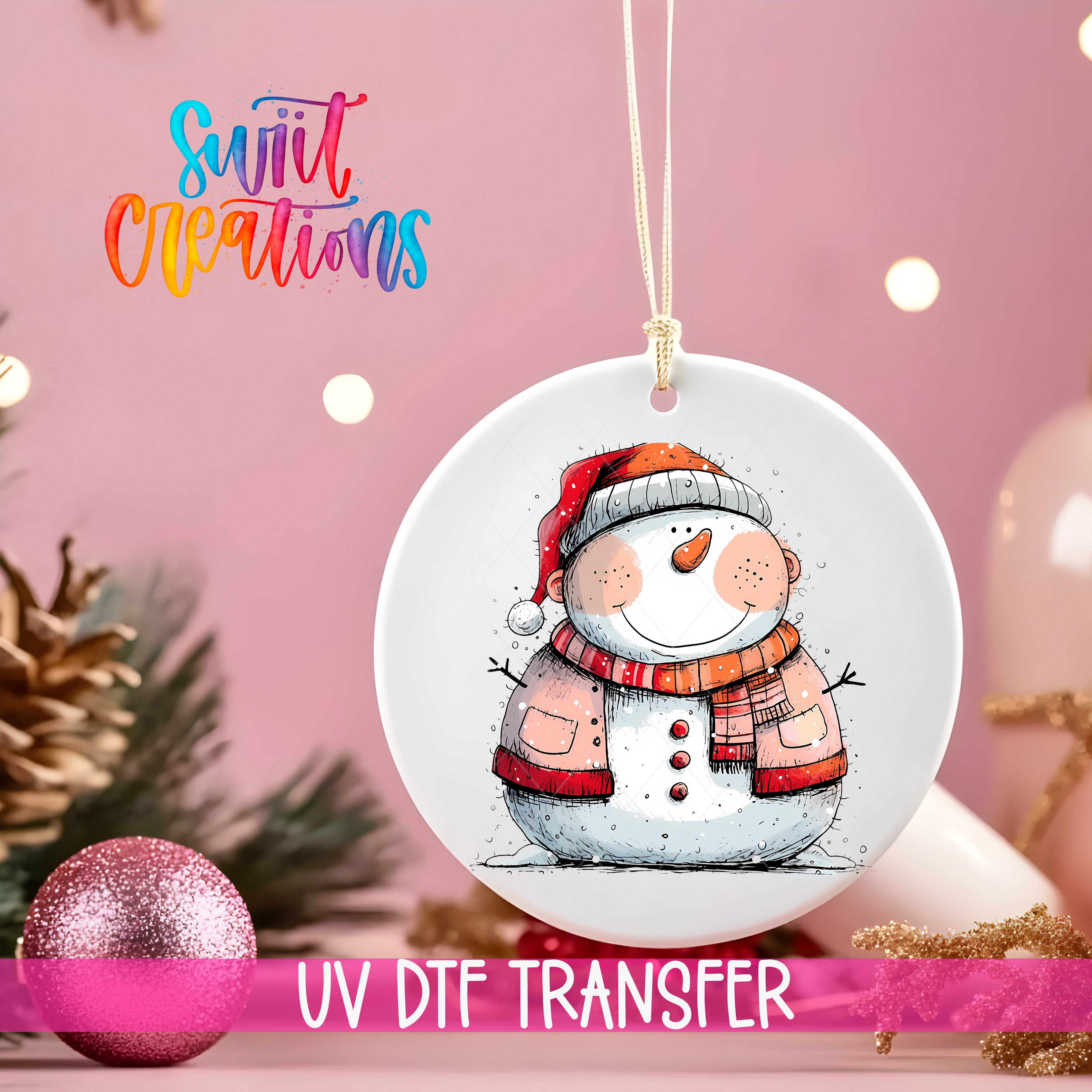 A white ceramic ornament with a snowman illustration is hanging on a string, surrounded by Christmas decorations and a pink background.