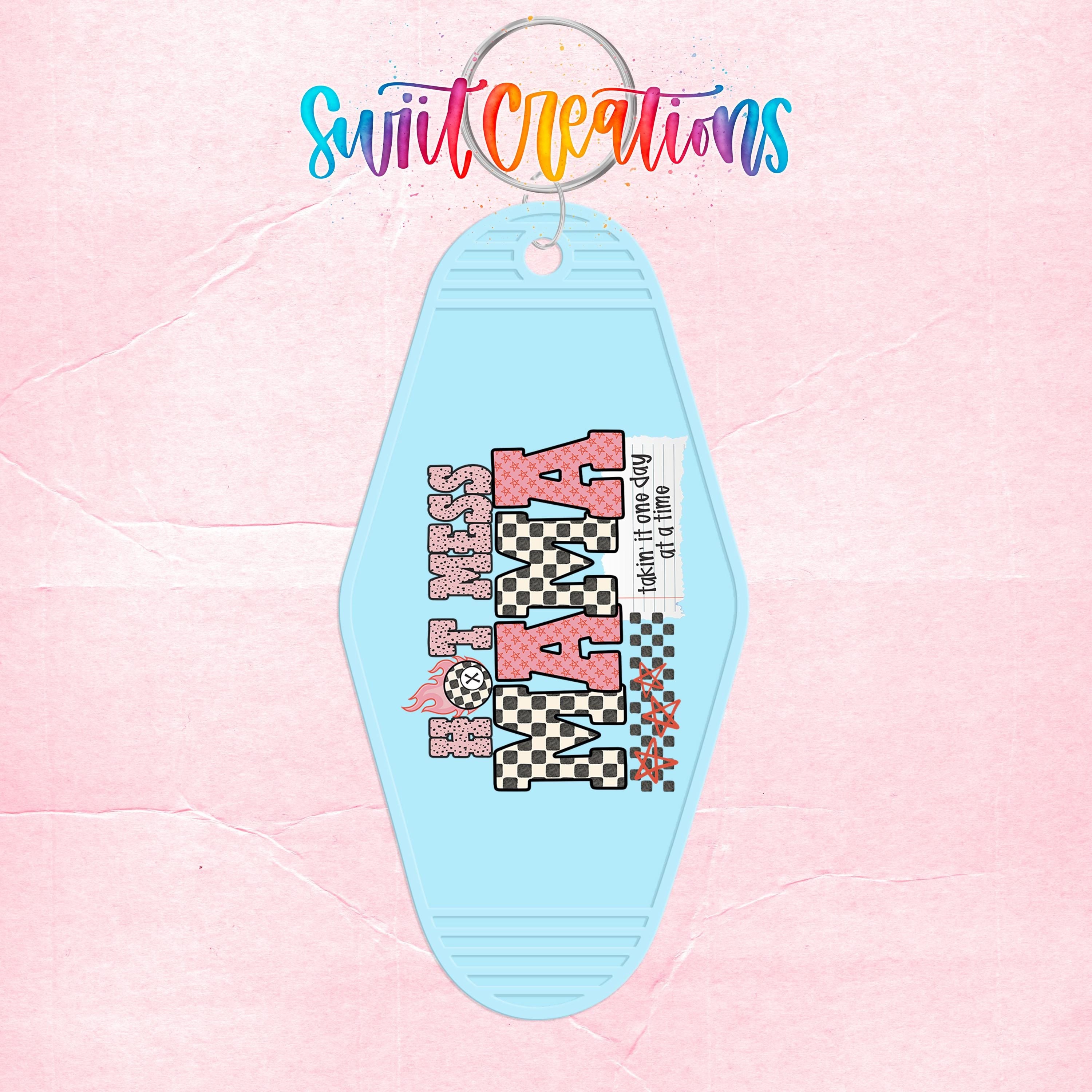 A keychain with a light blue color and a design featuring the text "Hot KISS" in pink and black, along with a checkered pattern.