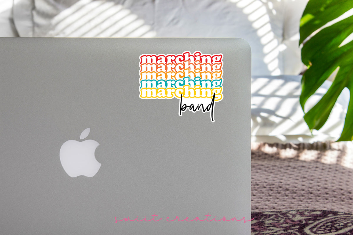 Retro Marching Band sticker on the lid of a silver laptop