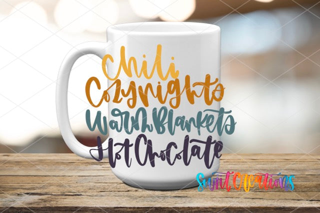 a white coffee mug with gold lettering on it