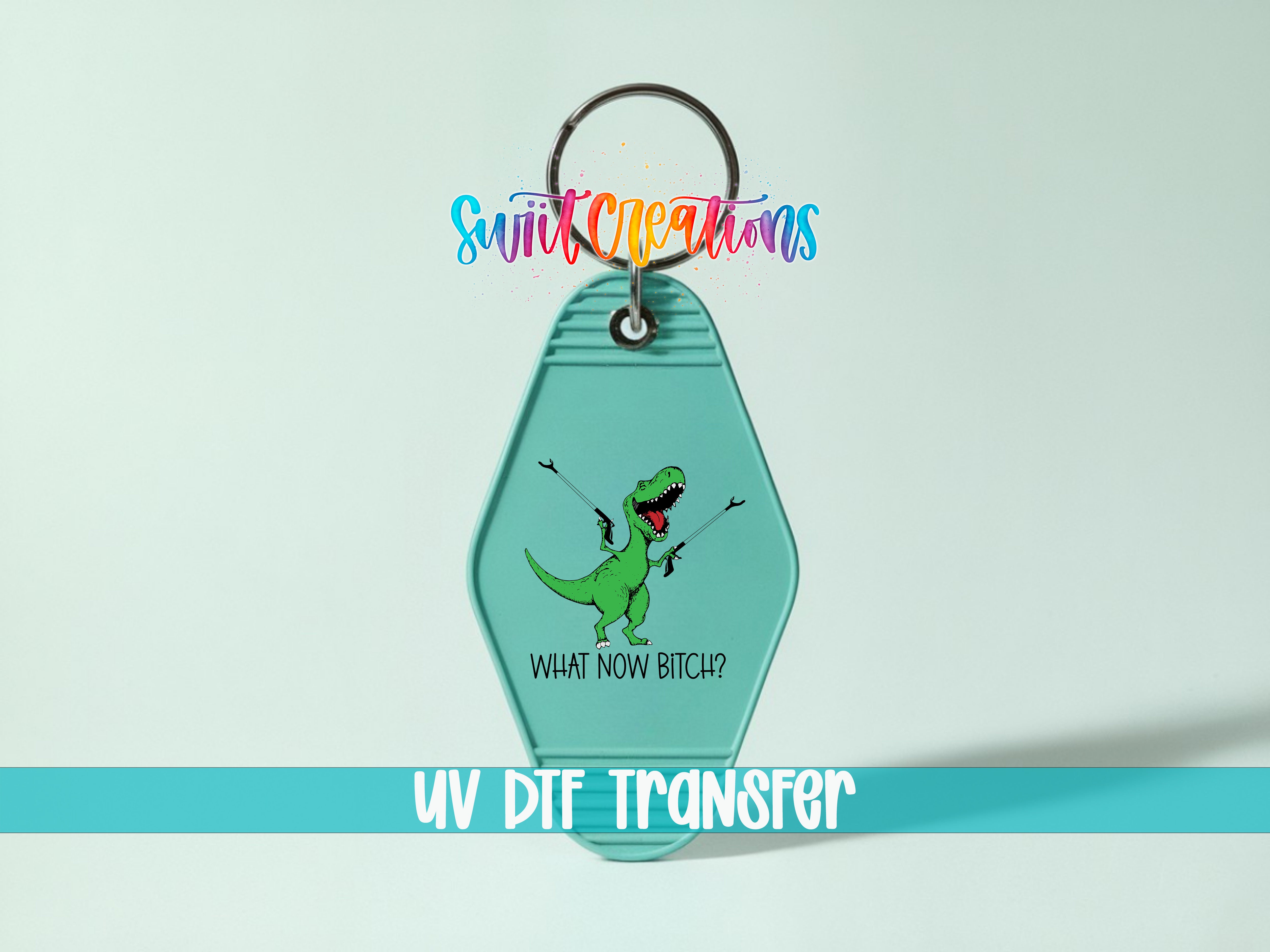 A keychain with a dinosaur graphic and text, along with a UV DIF Transfer label.