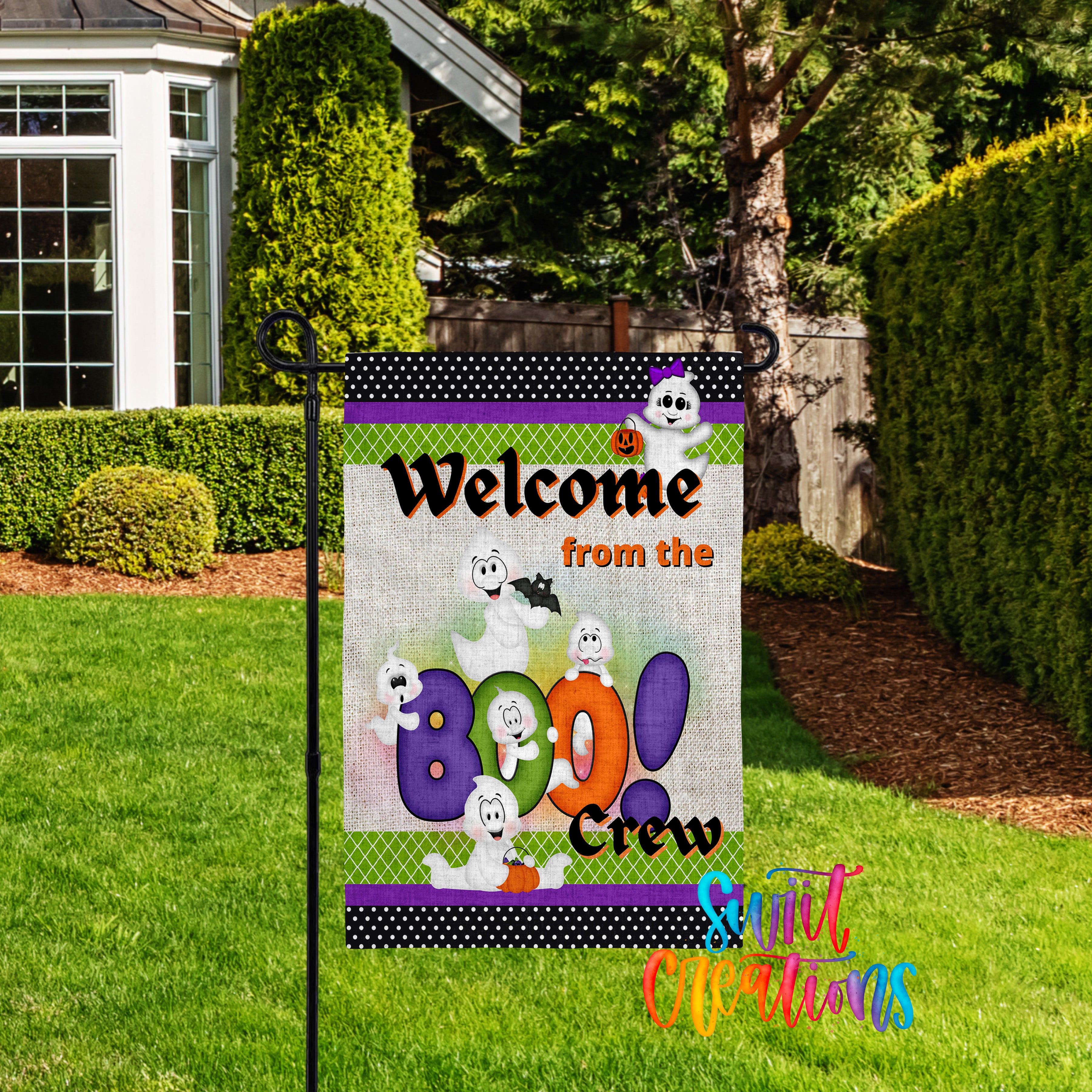 A yard sign welcoming visitors to the "BOO! Crew" with a Halloween theme, featuring cartoon ghost characters.
