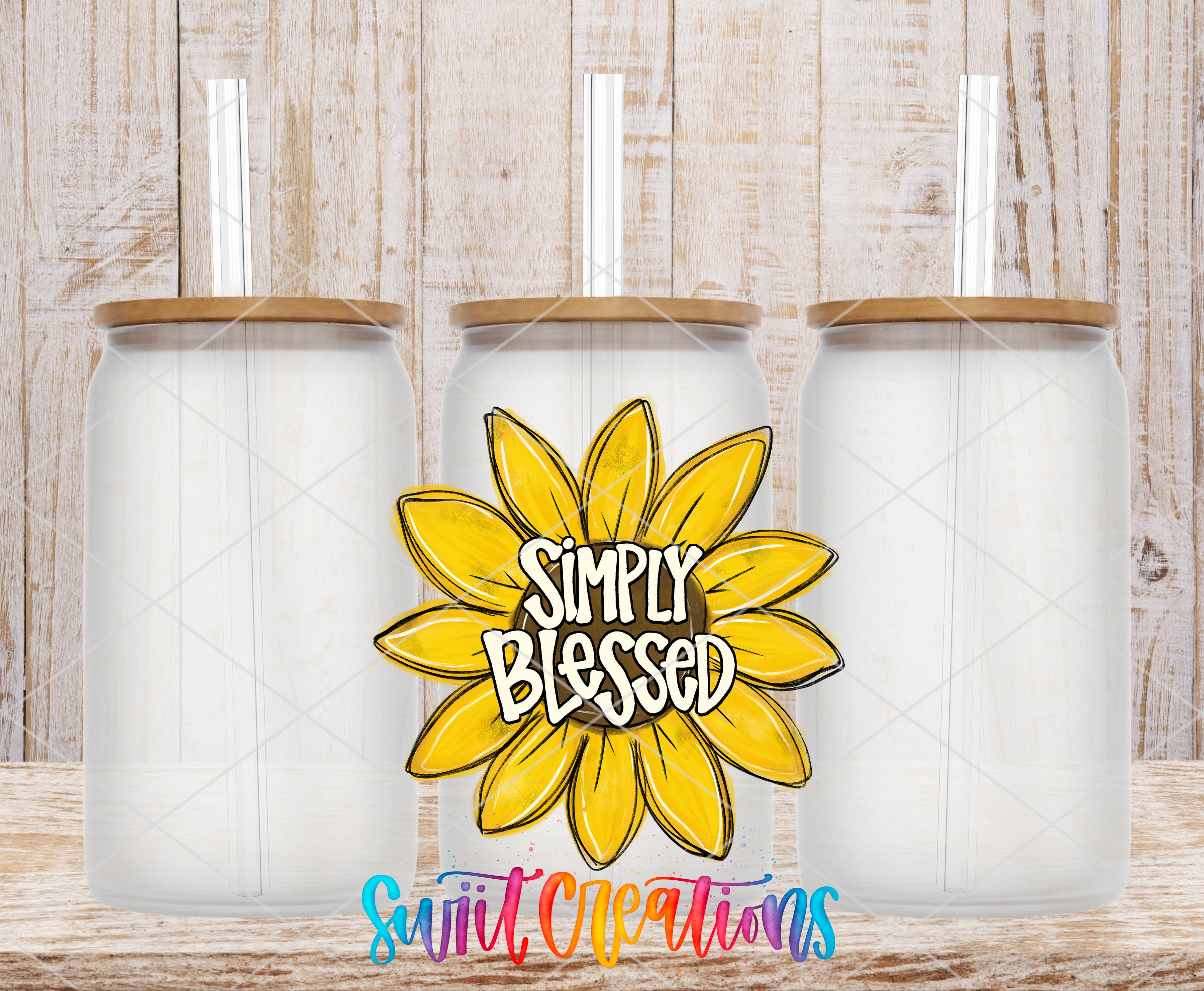 three clear glass jars with wooden lids, arranged in a row against a wooden background. In the center of the image, there is a yellow flower with the text "Simply Blessed" written on it.
