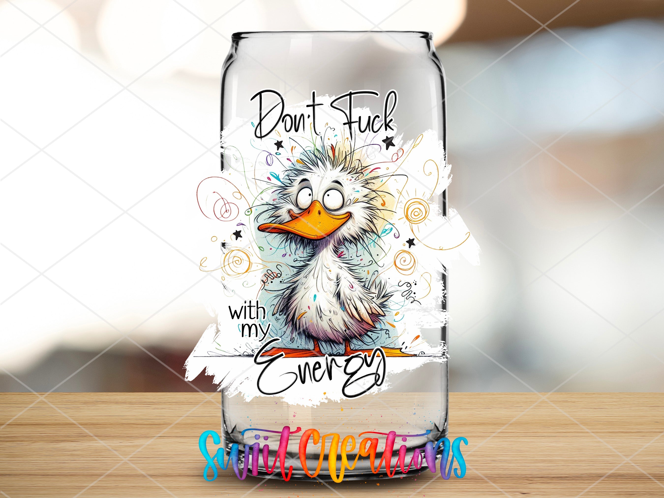 a glass with a picture of a bird on it