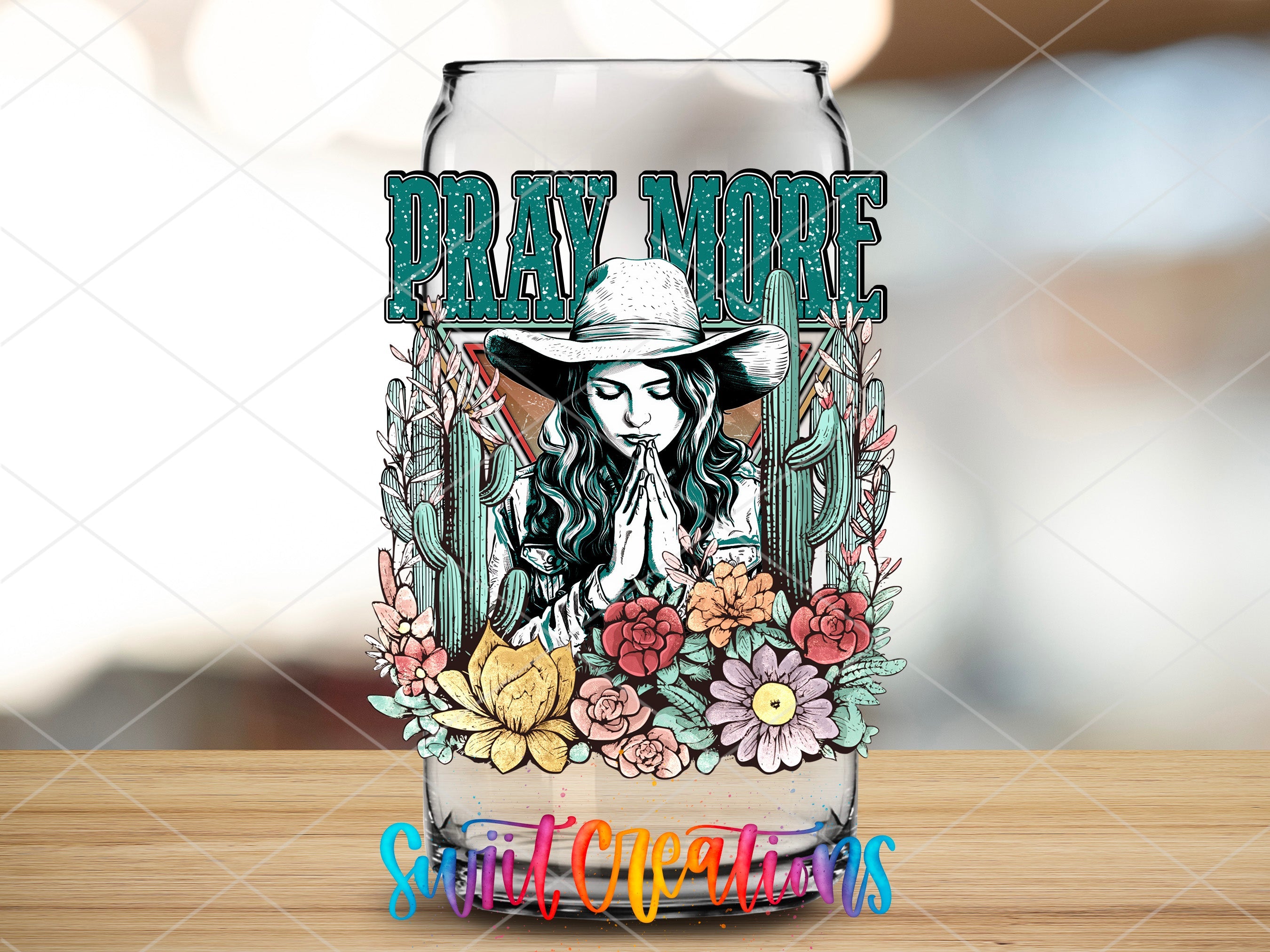 a glass with a picture of a woman wearing a cowboy hat