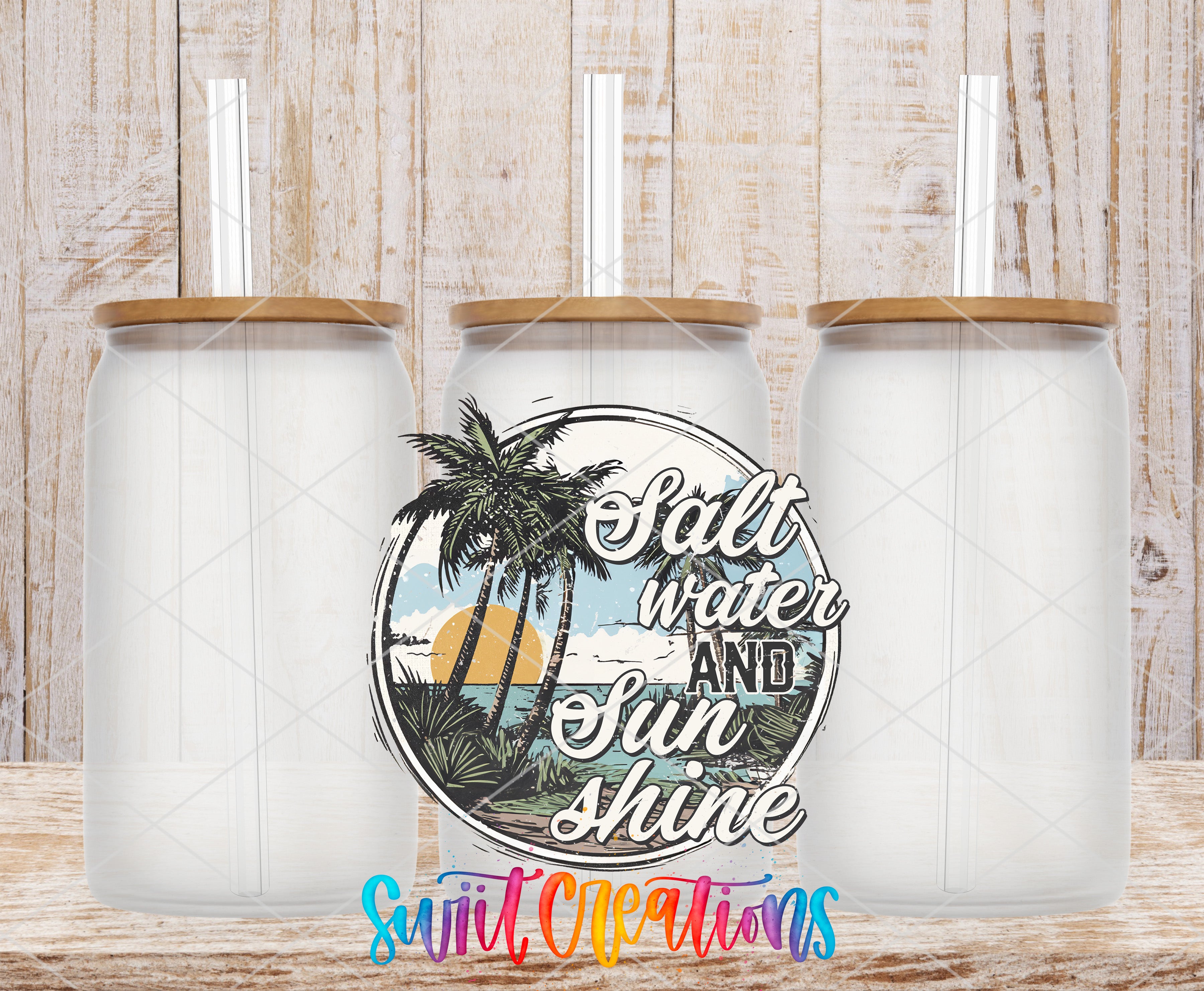 three clear glass jars with wooden lids, arranged in a row against a wooden background. The jars have straws attached to their lids. In the center of the image, there is a circular design with a palm tree and a sunset, along with the text "Salt water and shine" written around it.