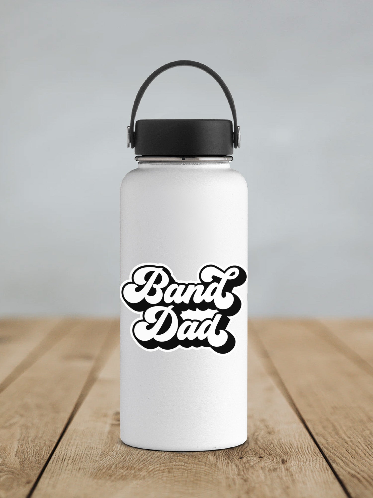a white water bottle sitting on top of a wooden table