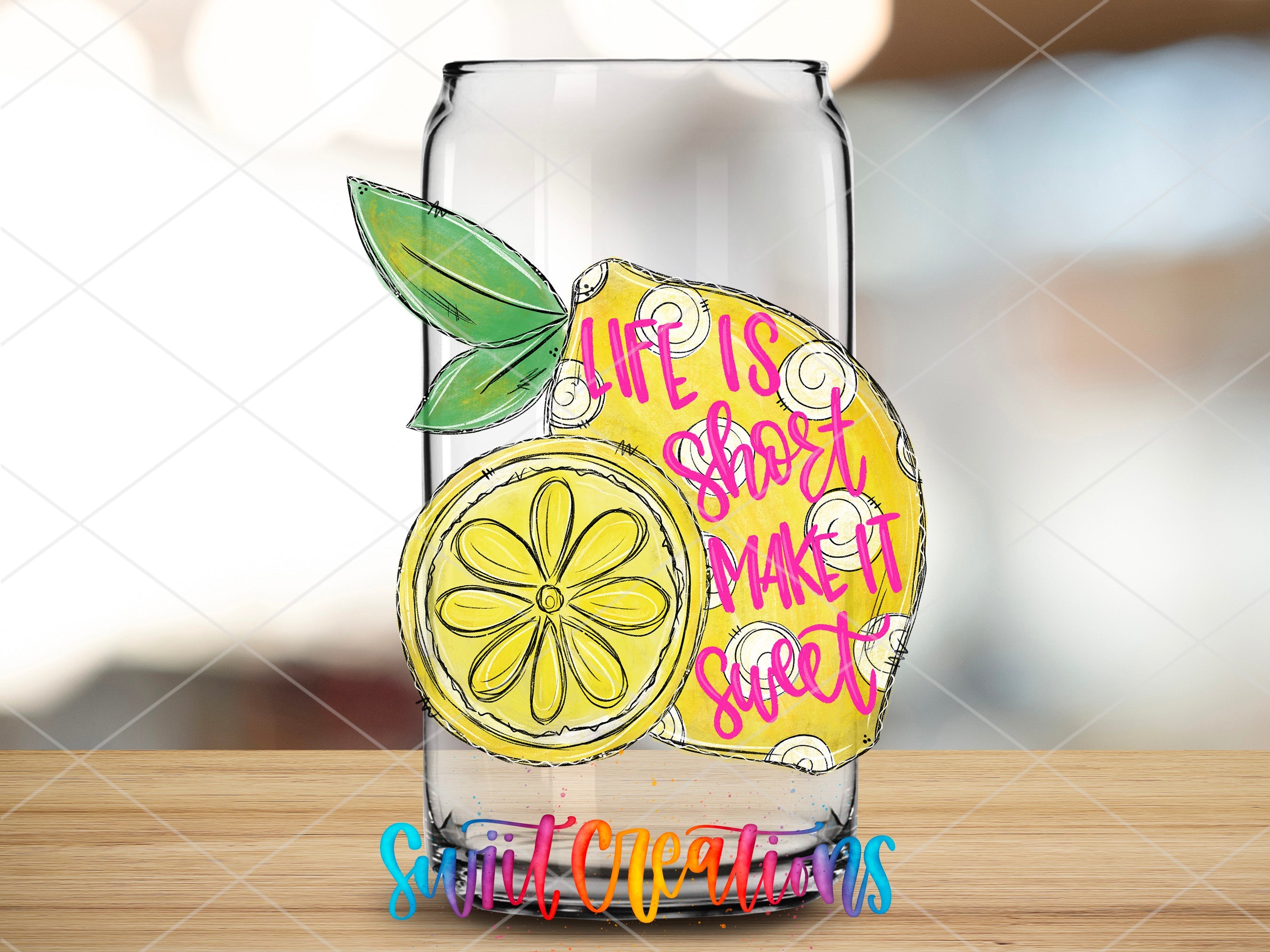 a glass with a drawing of a lemon on it