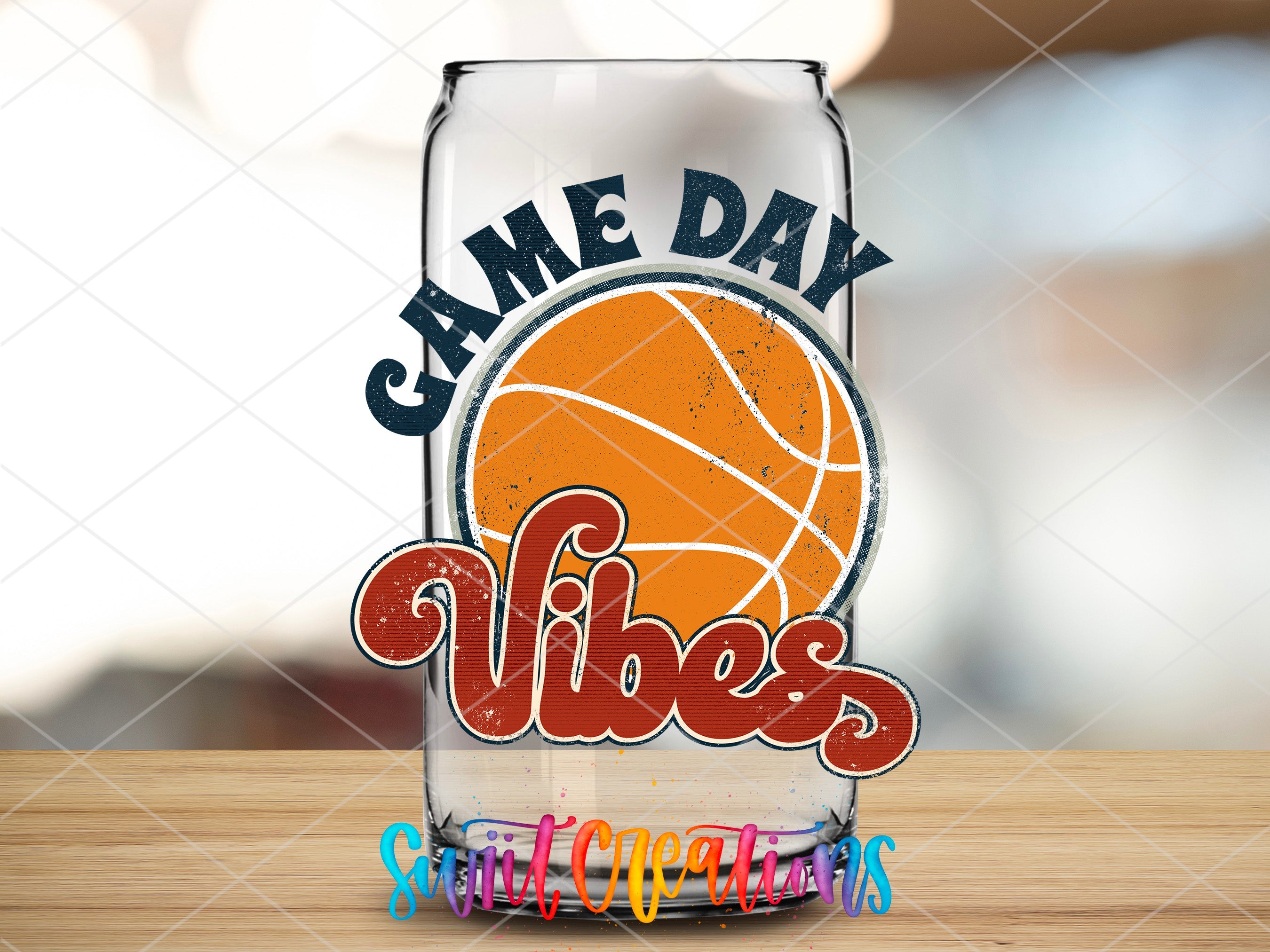 a glass with a basketball on it sitting on a table
