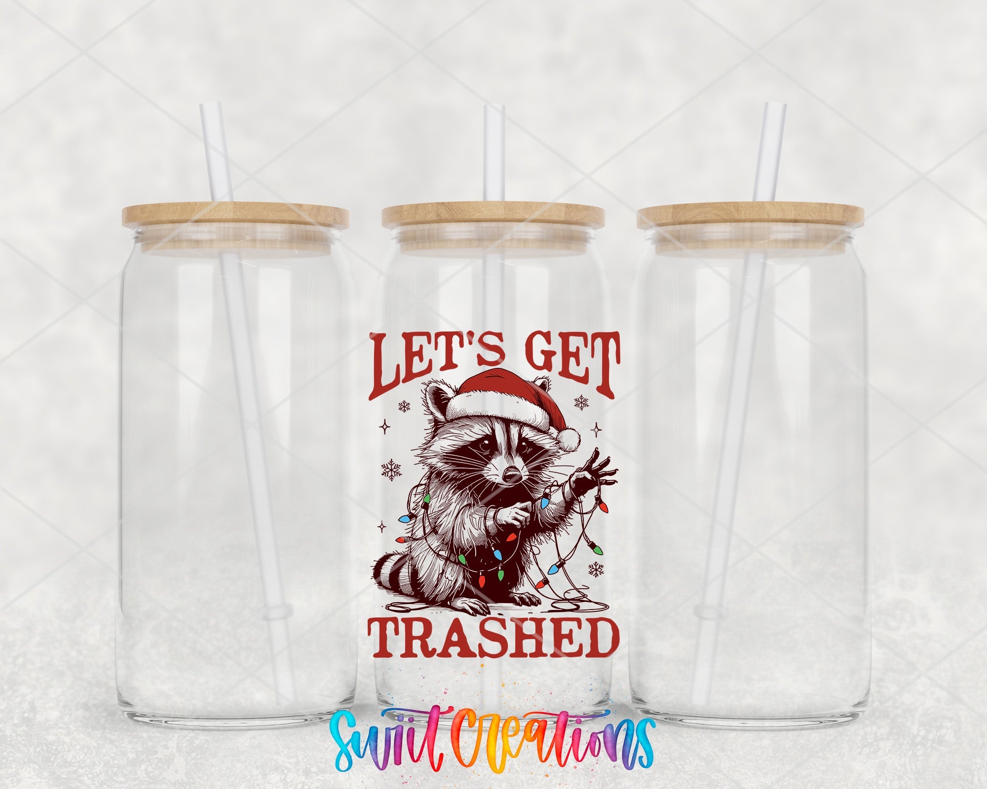 two clear tumblers with a raccoon wearing a santa hat