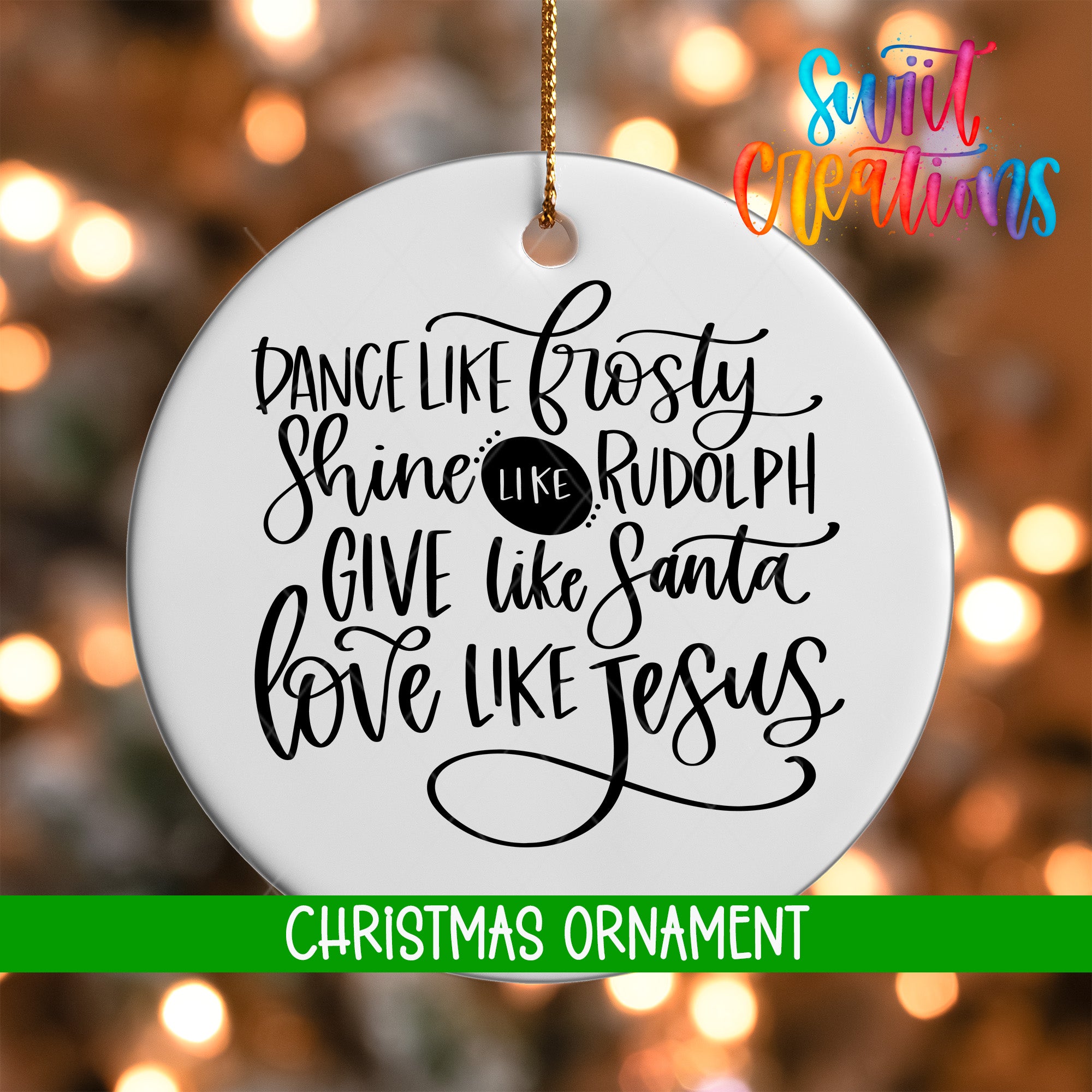 a white Christmas ornament with black text that reads "Dance like frosty, shine like Rudolph, give like Santa, love like Jesus".